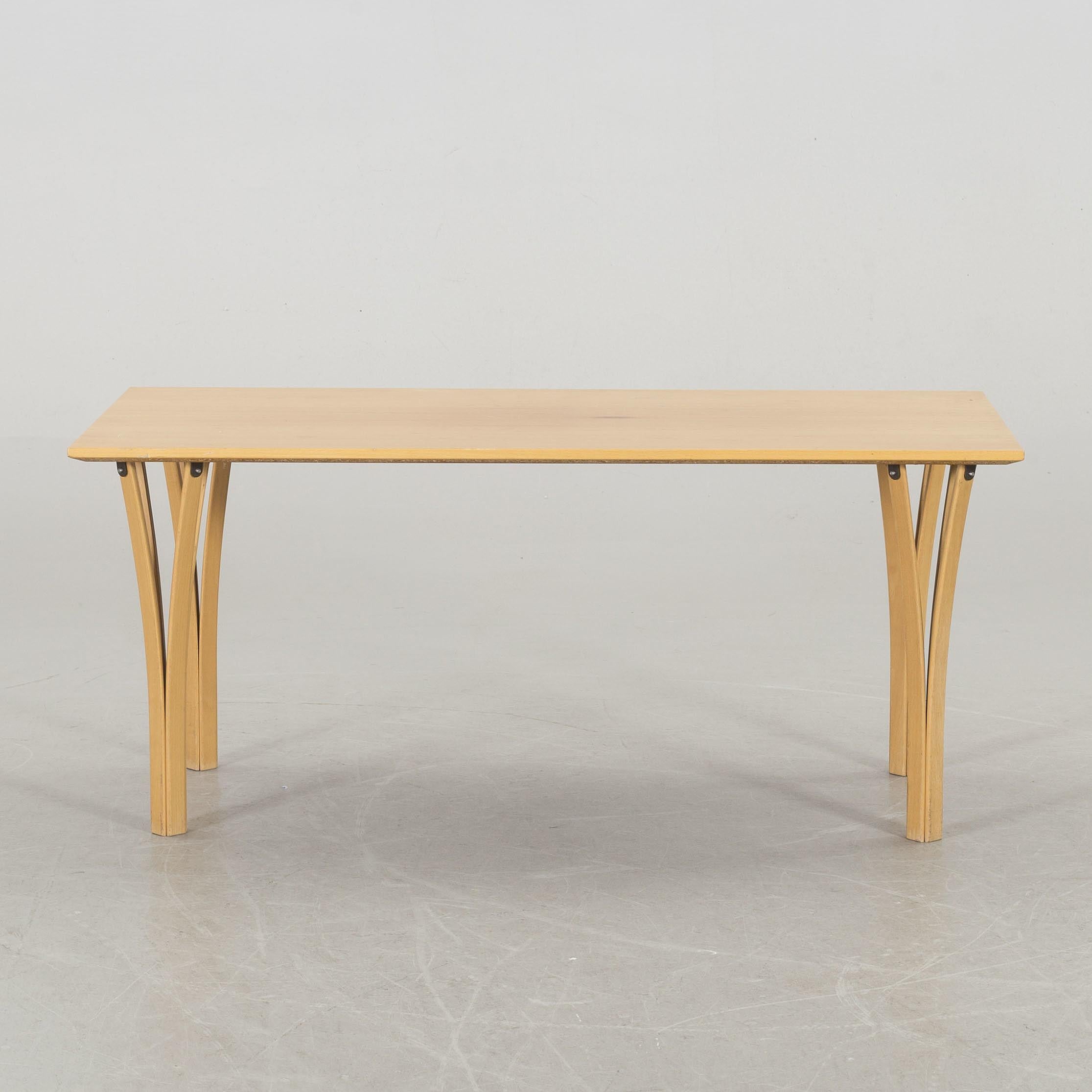 A sofa table with beech top and legs in Ash wood from 1984. 


