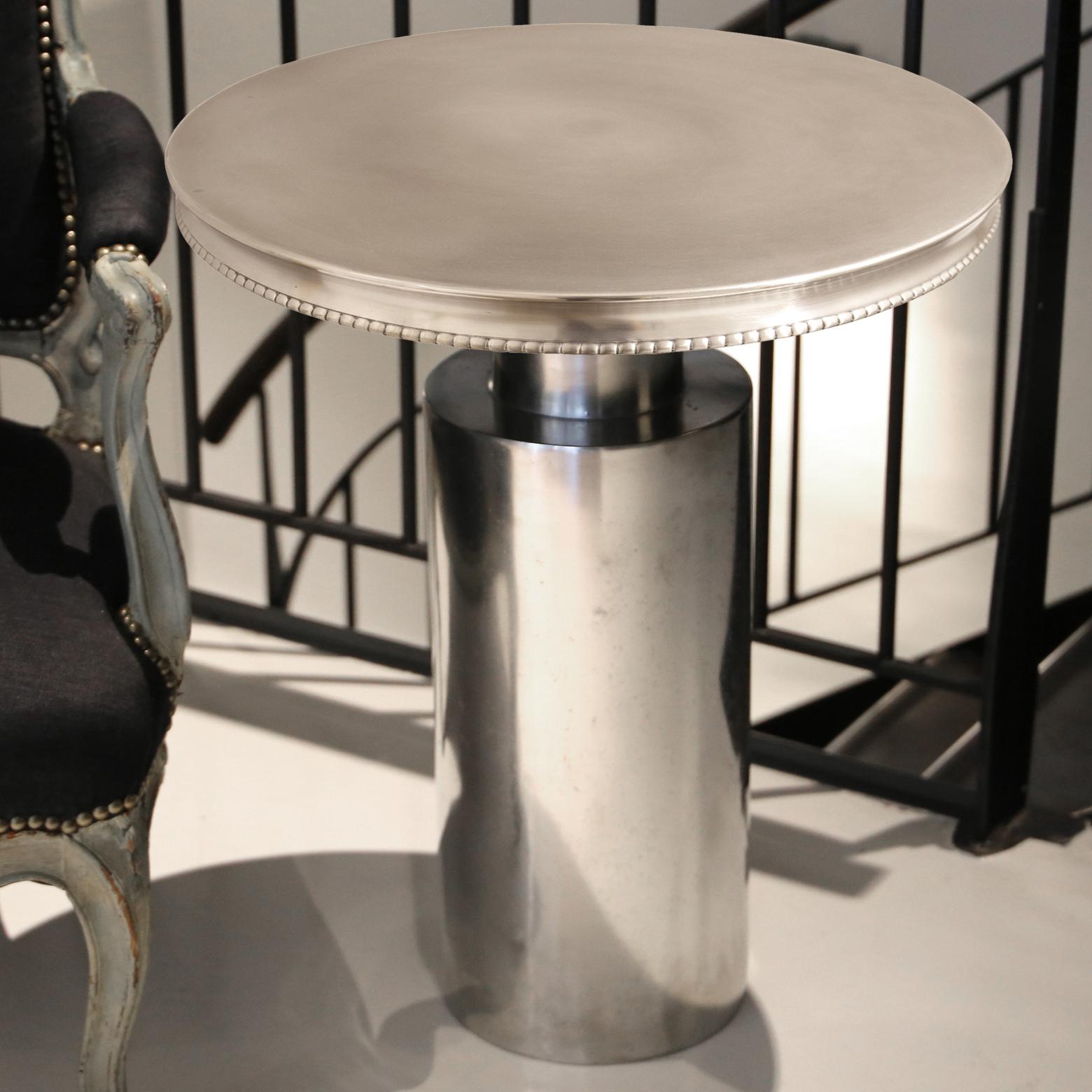 Made to order. We can offer different mouldings or finish.
This side table (board and pedestal) is made of culinary pewter hammered onto a wooden form, like the famous french pewter countertops which has been part of Parisian cafés and bars' life