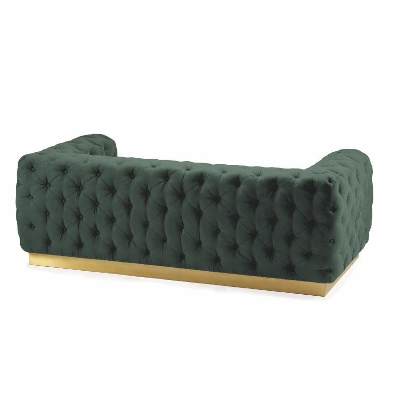 With perfect poise and structure, Victoria couch will welcome you and your guests into an incredibly confortable and elegant seating experience. 
Victoria couch is upholstered in emerald green velvet and finished with a polished brass footer. Made