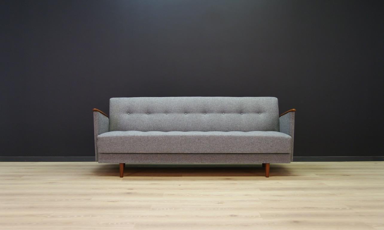 Splendid sofa from the 1960s-1970s, a Minimalist form - Scandinavian design. Original armrests made of teak wood, upholstery after replacement (gray - color). Preserved in good condition (minor scratches on the armrests) - directly for