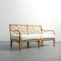 Sofa with bamboo frame, geometric decoration on the backrest, and white chenille