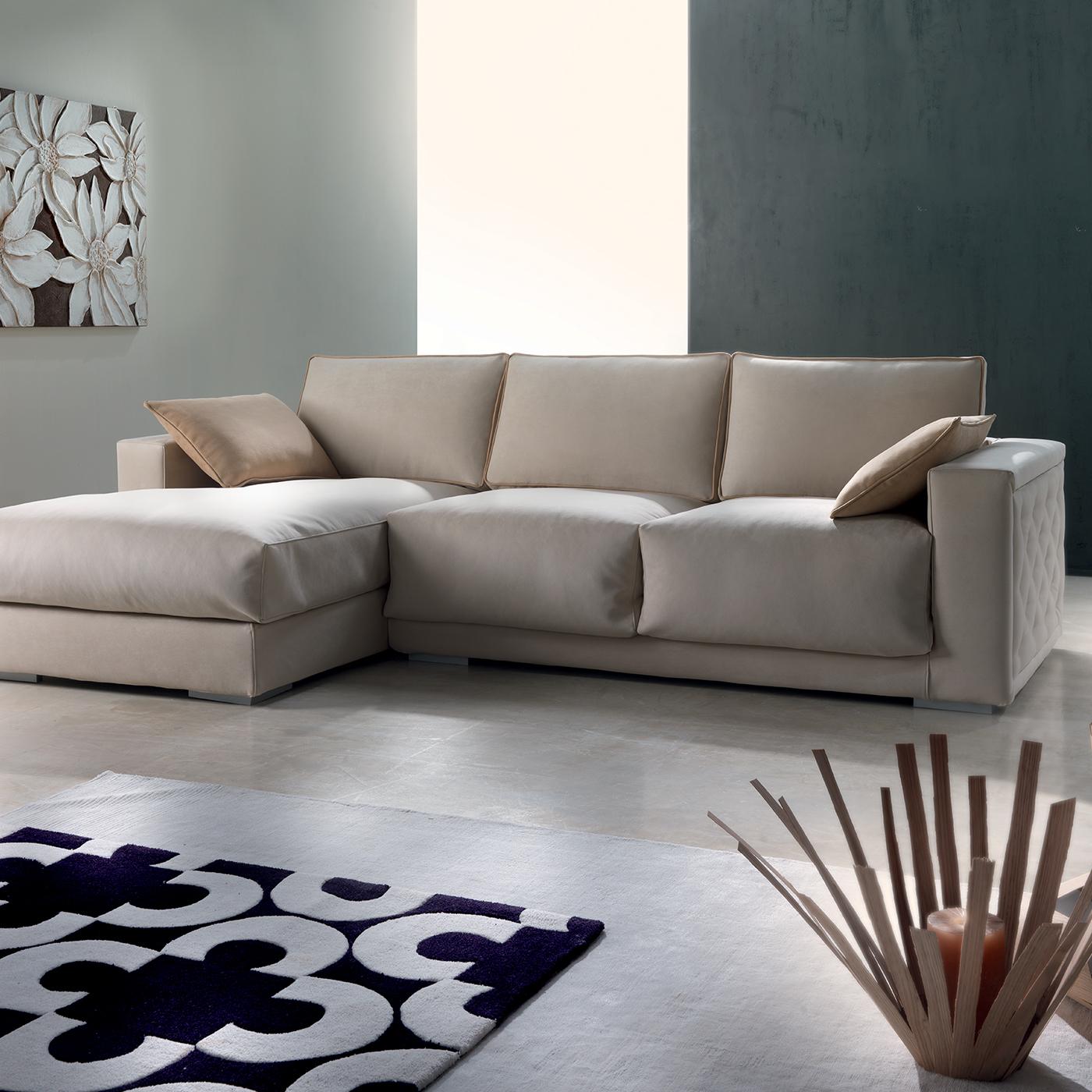 Providing ample and comfortable seating in a modern living room, this sofa with chaise lounge is a sophisticated piece that will suit a variety of decors, thanks to its neutral fabric upholstery and exquisite craftsmanship. The plush seat cushions