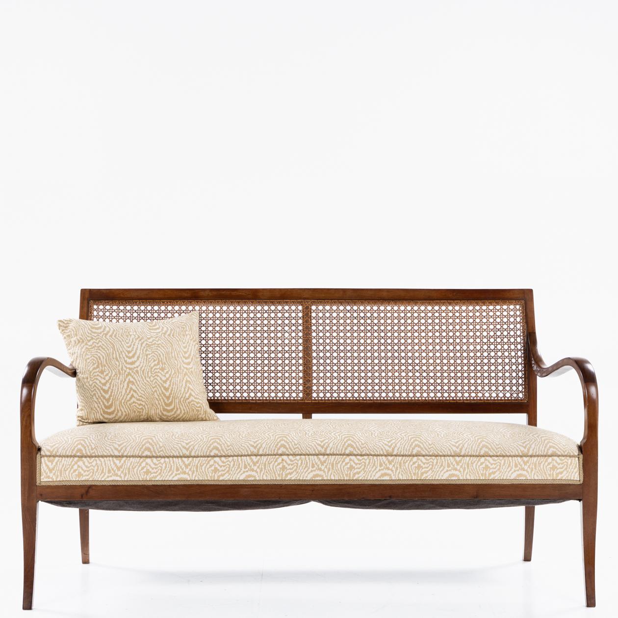 Sofa with curved armrests by Frits Henningsen. Three matching chairs available For Sale 1