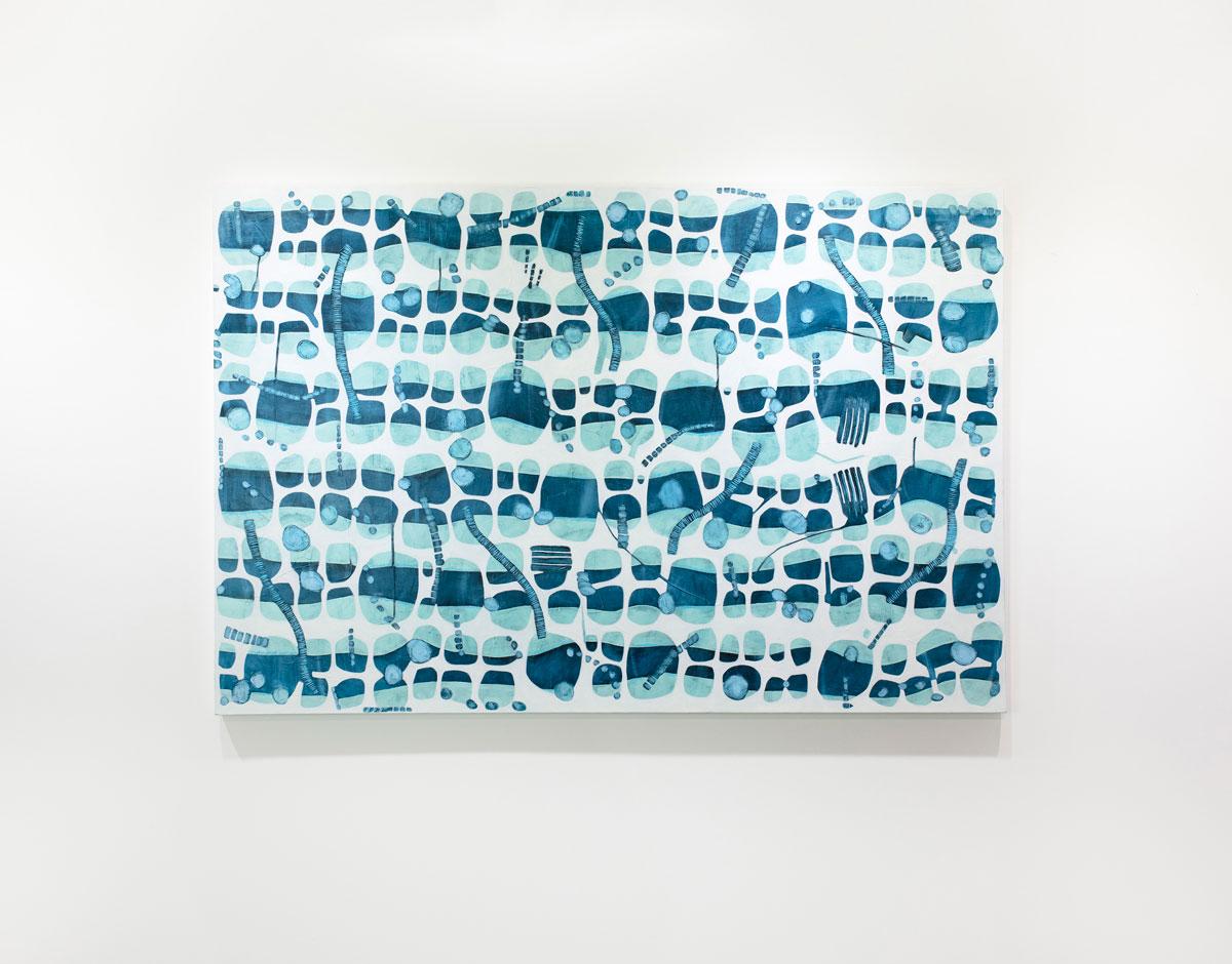 This large abstract horizontal statement painting by Sofie Swann features a blue and white palette, with varying organic circular shapes layered throughout the canvas. This painting is made on gallery wrapped canvas with painted sides. It is signed