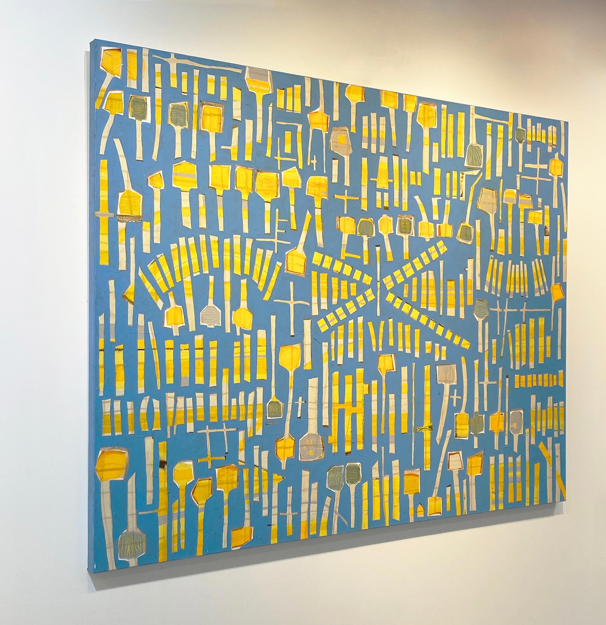 This large-scale abstract painting features a bright blue background with vibrant, complementary yellow shapes covering the canvas. The shapes are mostly rectangular, with some larger ones including a square-like shape at the top, making them look