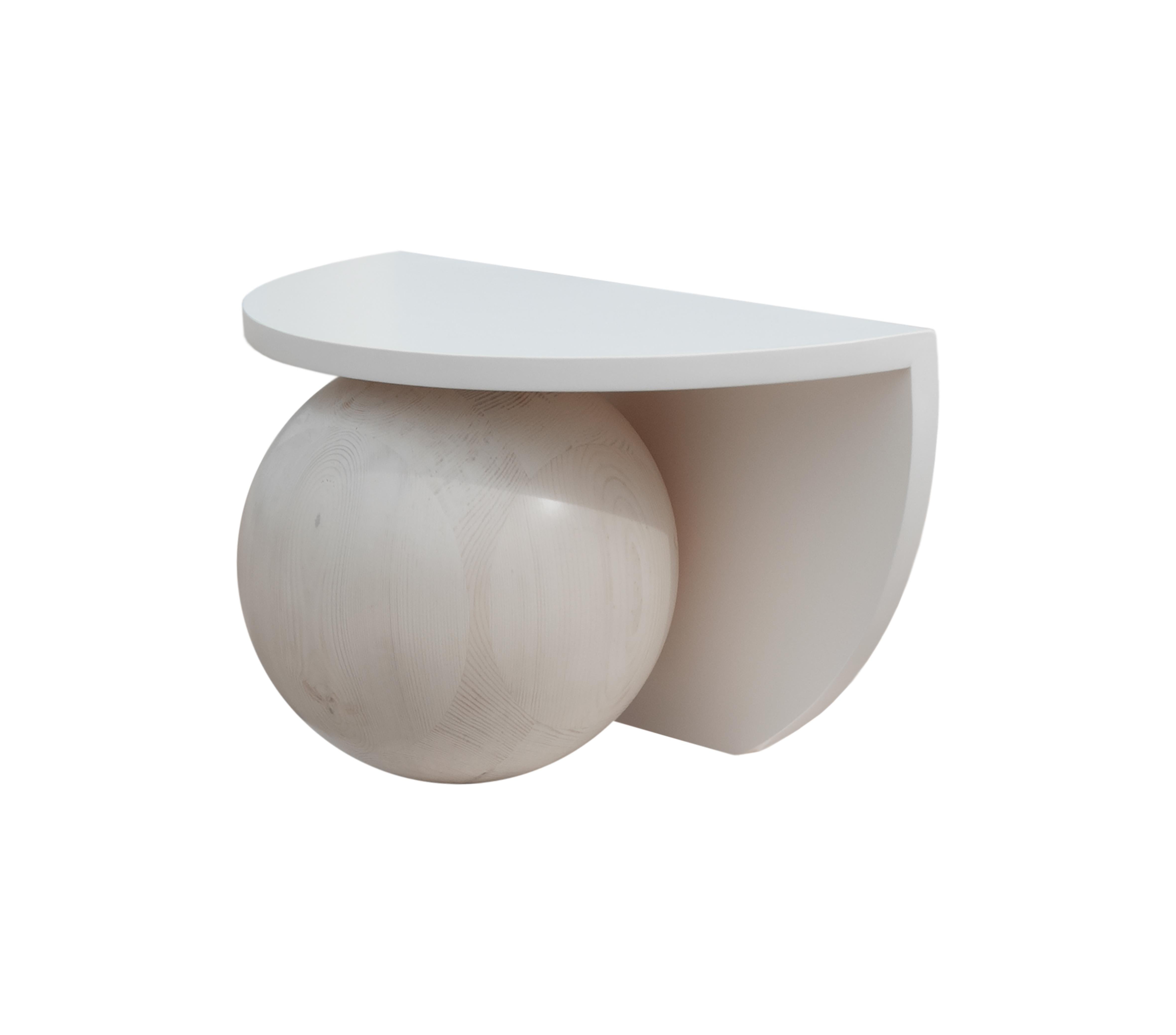 MDF surfaces and Swedish pine solid wood spheres lacquered in creamy beige colour. Manufactured by local artisans in Cyprus.

This compact low level piece elaborates the curved profiles of the series in three dimensions. made out of two intersecting