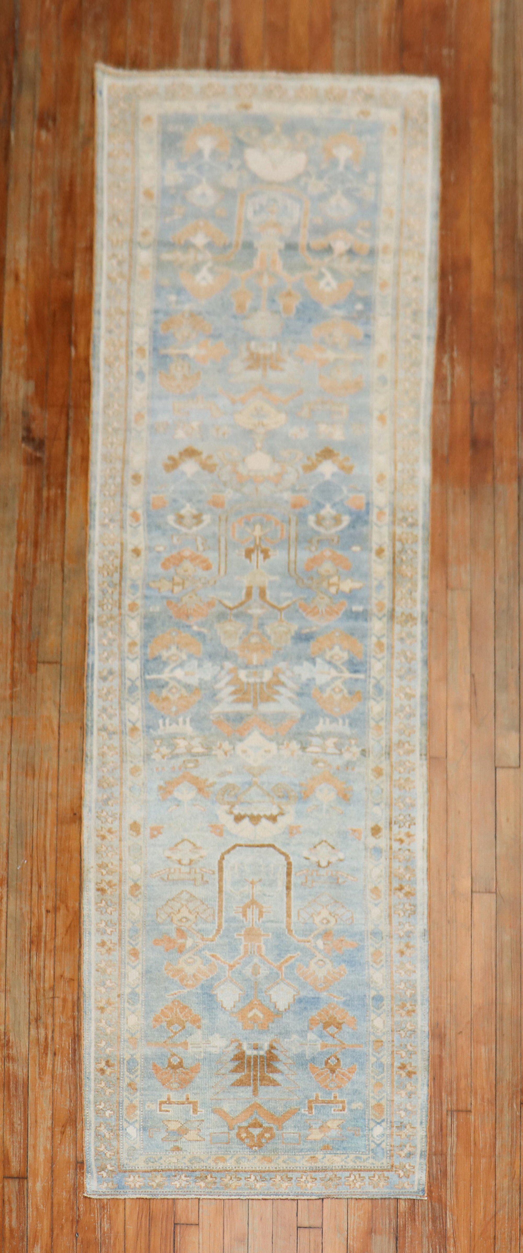 Early 20th century Persian Malayer rug in soft blue, brown, and apricot tones

Measures: 2'9'' x 9'7''.

