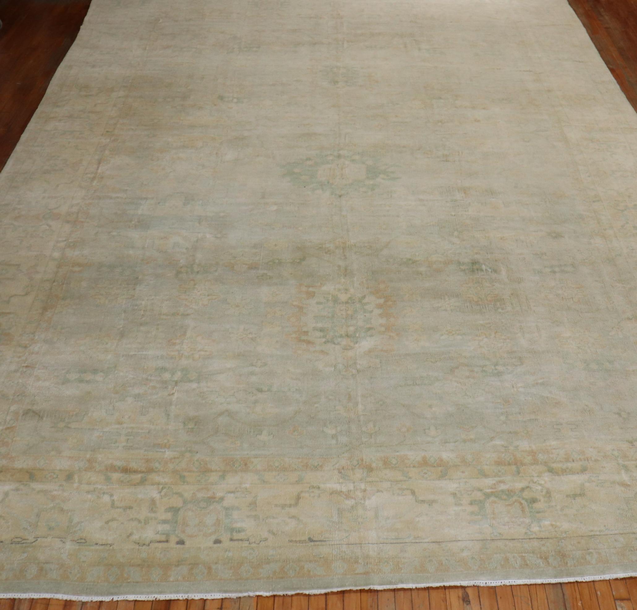 Phenomenal large size handmade Turkish Oushak in pale colors, This piece was originally custom made for a client in the 3rd quarter of the 20th century

Measures: 12'10'' x 19'10''

Oushak rugs originated in the small town of Oushak in