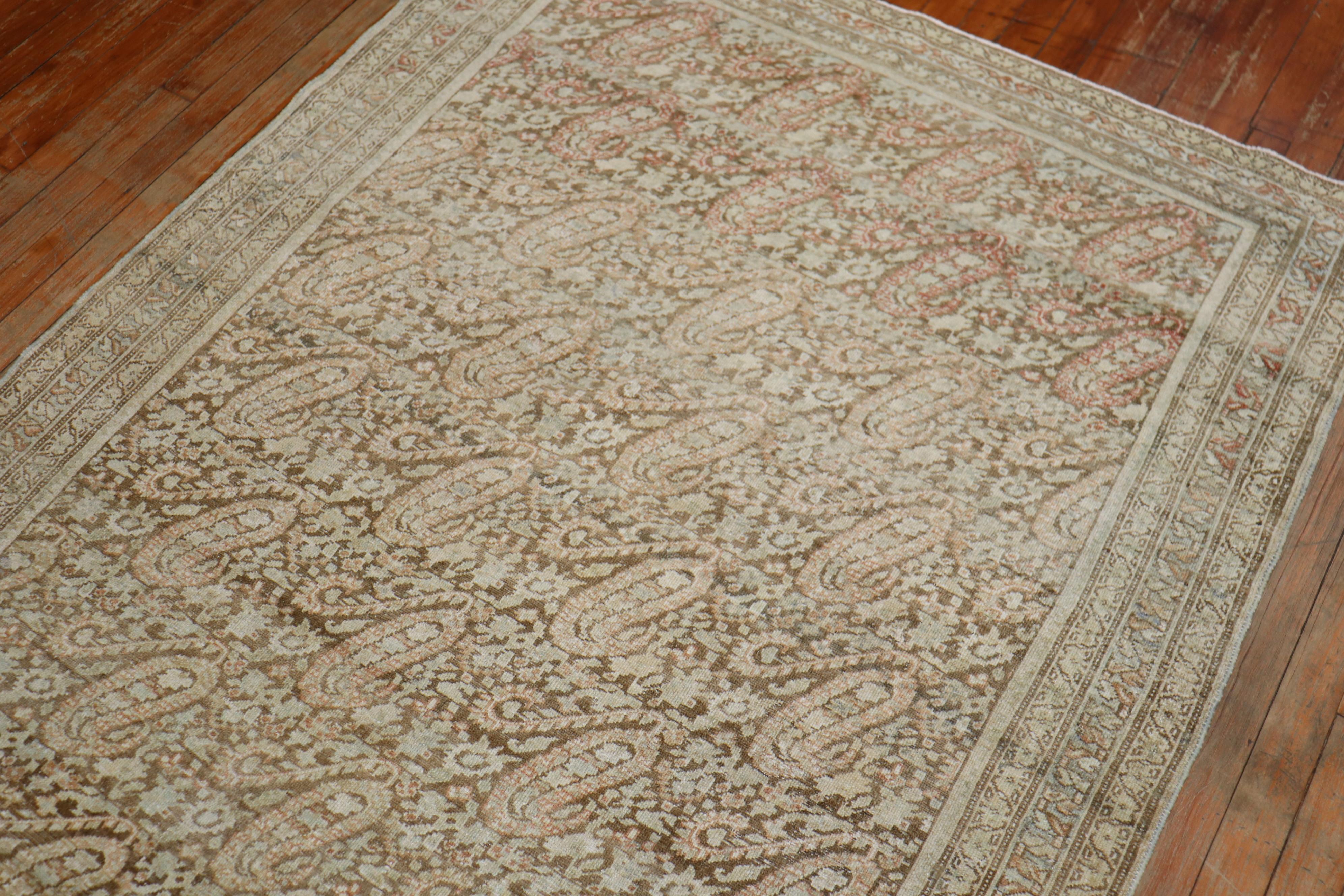 Authentic handmade Persian Malayer rug featuring a spiraling boteh paisley design in soft earth tones

Measures: 4'5' x 6'4''.