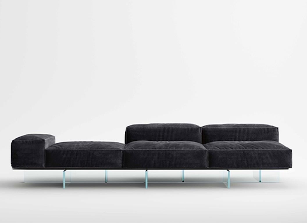 Made of soft volumes and generously upholstered, the seating system Soft Glass introduces a new way to design the living area, with modules that give life to original compositions, more dynamic and informal.

Both in the more relevant or more