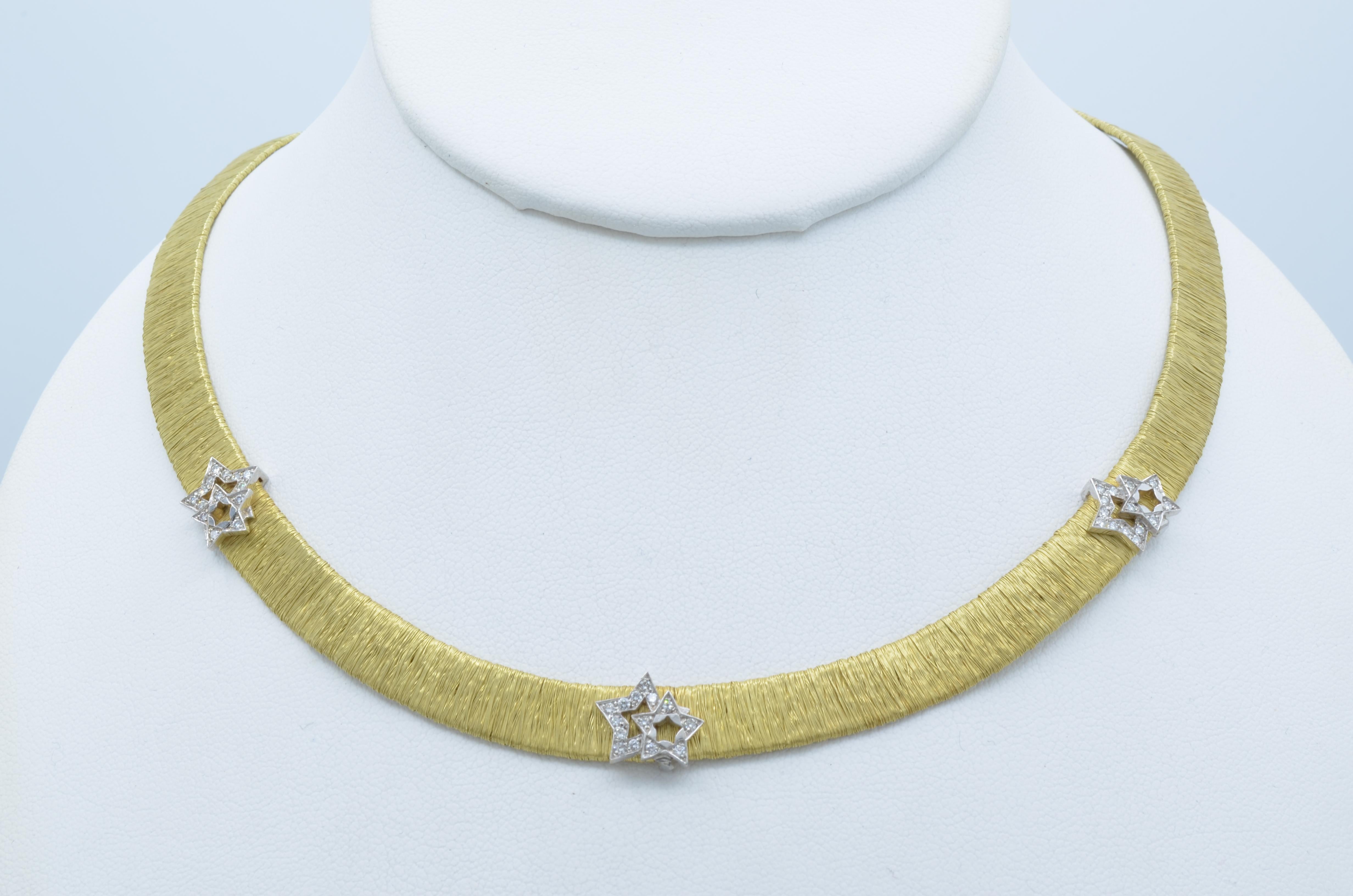 It's the trend again, in the manner of some very famous Italian Jeweler this a soft necklace in 18k gold mesh with some sparkling diamond double stars. As you can see on the picture with black back ground the necklace is embracing any form and