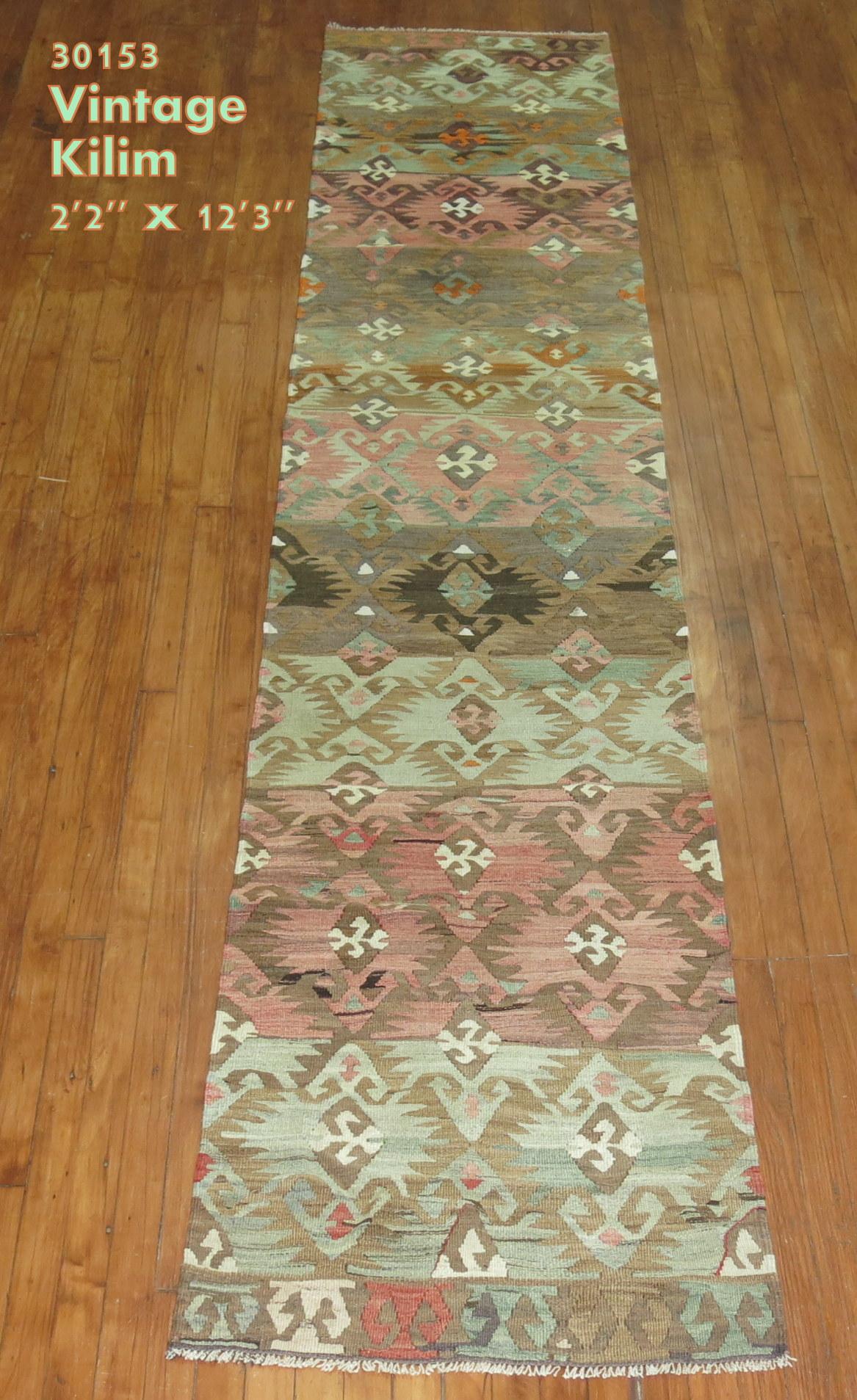 20th century geometric Turkish runner in casual tones in green, pink brown, mid-20th century.

Measures: 2'2