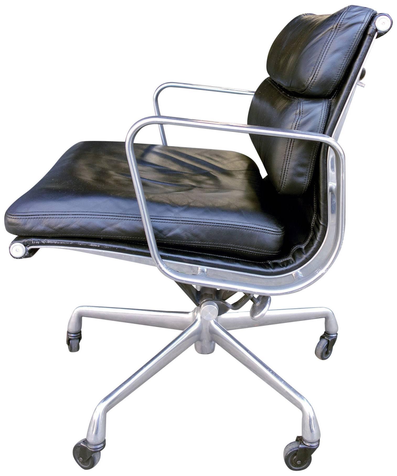 For your consideration we have Eames for Herman Miller vintage soft pad chairs in black leather with low backs. 

These authentic vintage examples are icons of Mid-Century Modern design. The chairs part of the Eames aluminium group designed for