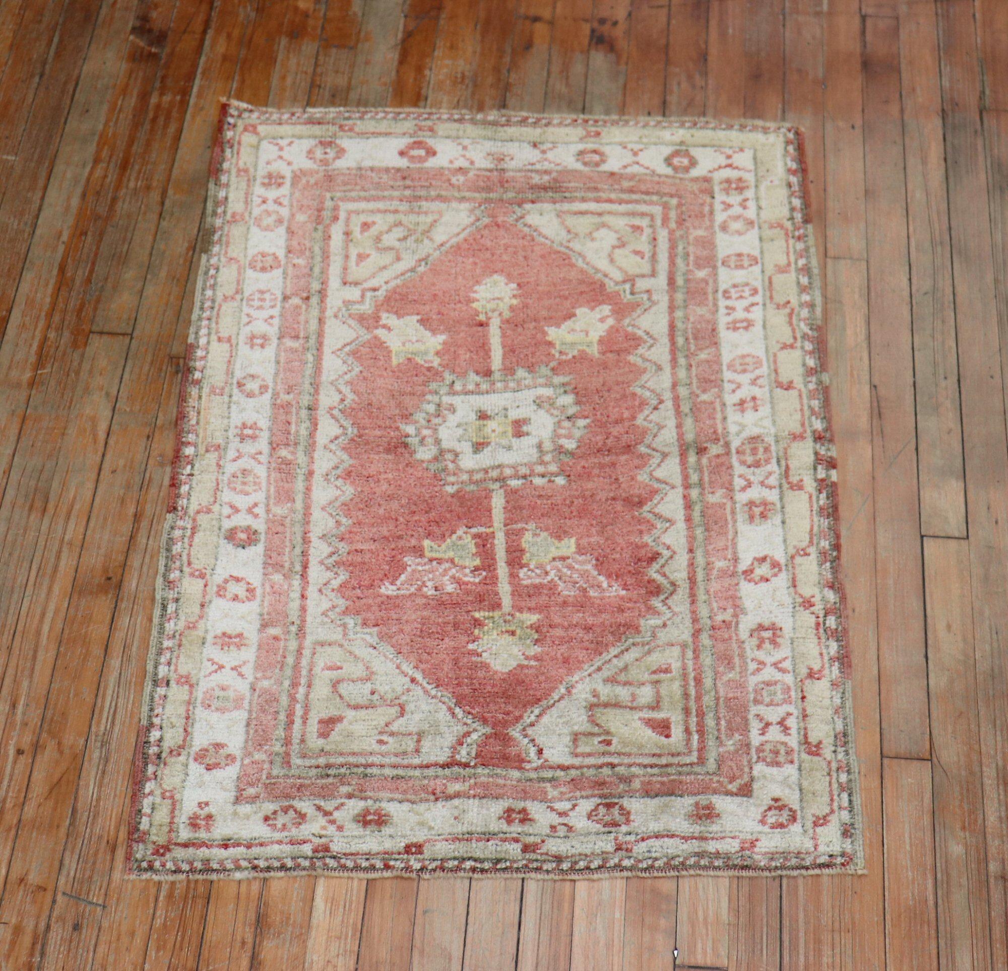 One of a Kind vintage Turkish Anatolian rug with a soft melon red, accents in gray and soft brown

Size: 2'10