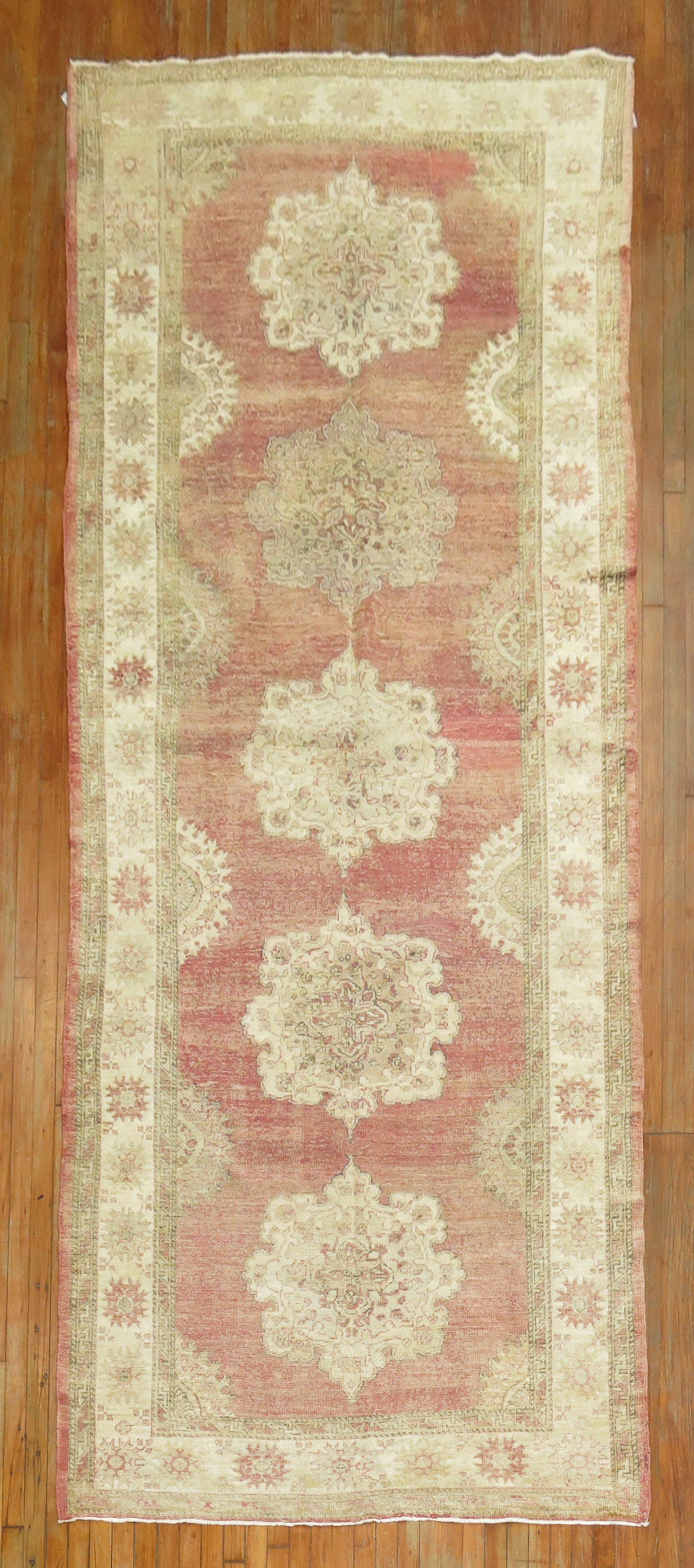 A mid-20th century Turkish Oushak gallery size worn Runner 

Measures: 5' x 13'1''.