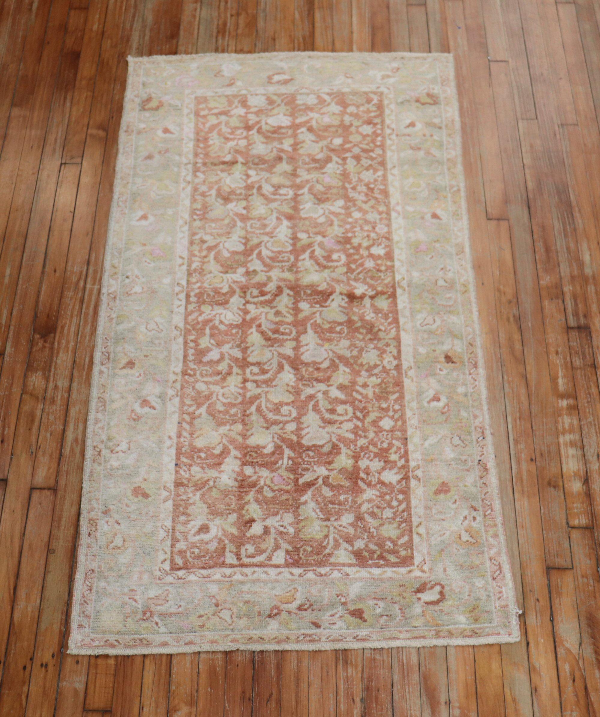 A small runner size vintage Turkish Oushak rug with a floral design, circa mid-20th century.

Measures: 3'2