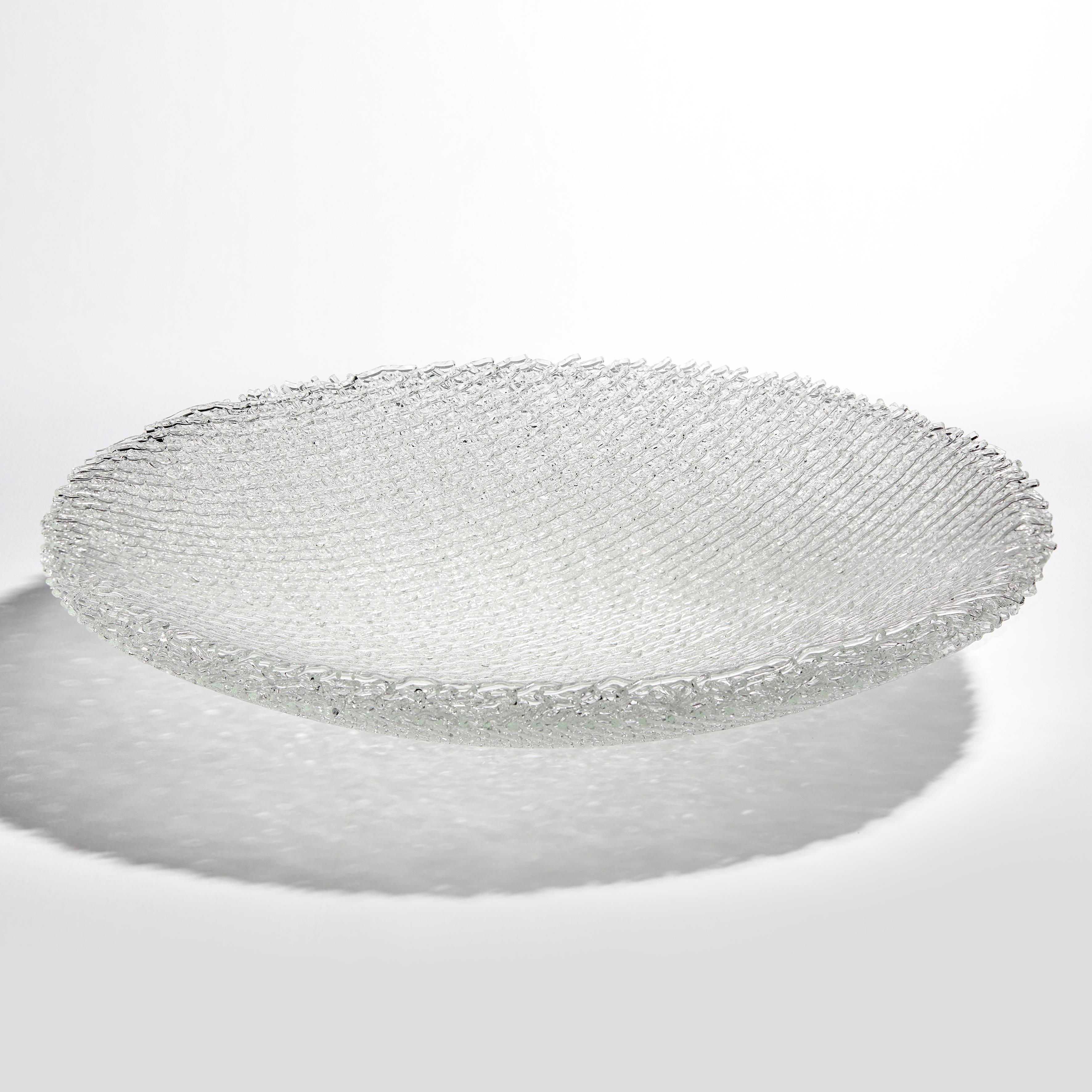 Soft Rime is a unique clear glass sculptural centrepiece by the British artist Cathryn Shilling. Sharing intricate detail with the artwork's natural counterpart, Soft Rime is created from a multitude of layered glass canes. Appearing as if woven