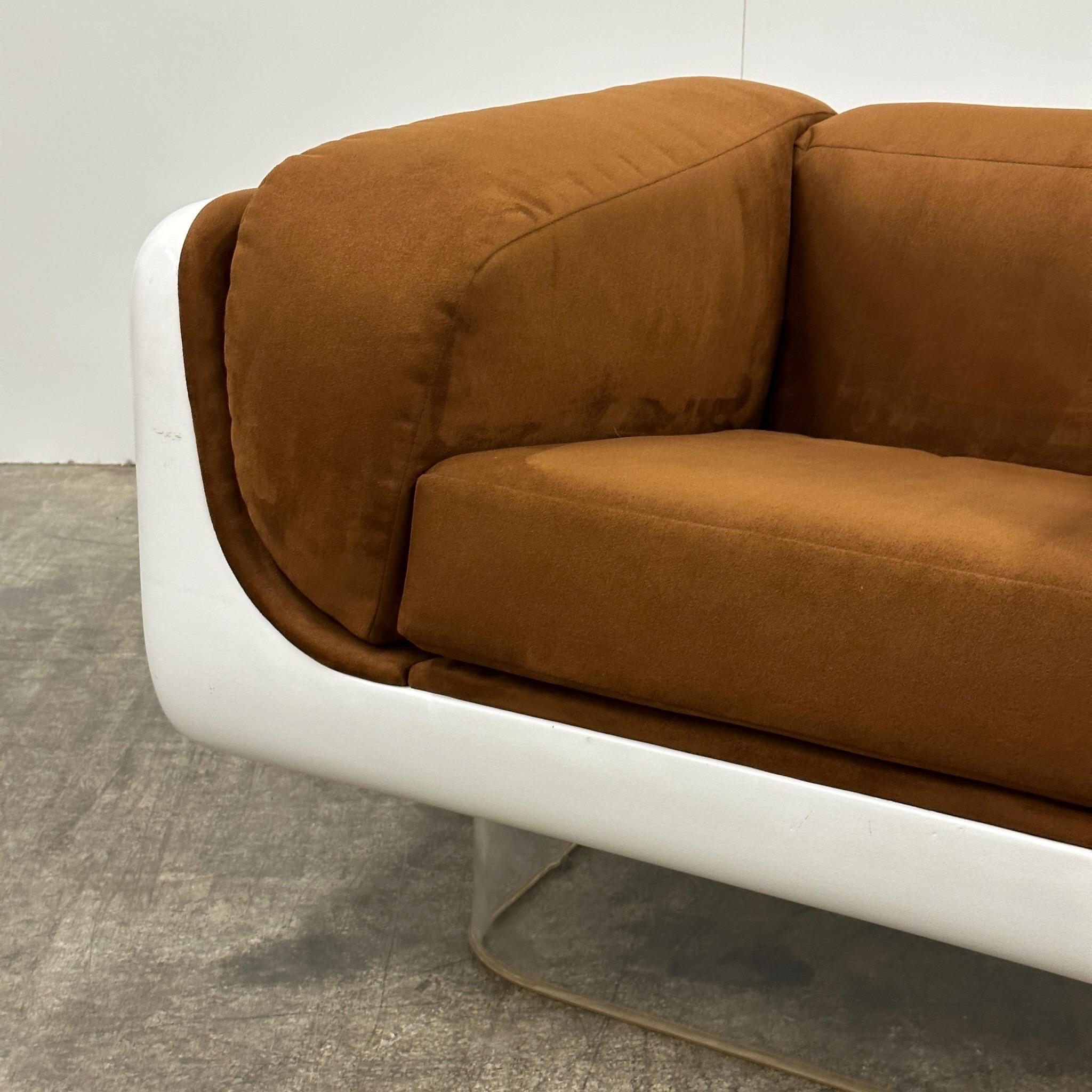 Made in the USA. High gloss white finish on a lucite base. Reupholstered in brown suede. Extremely rare.