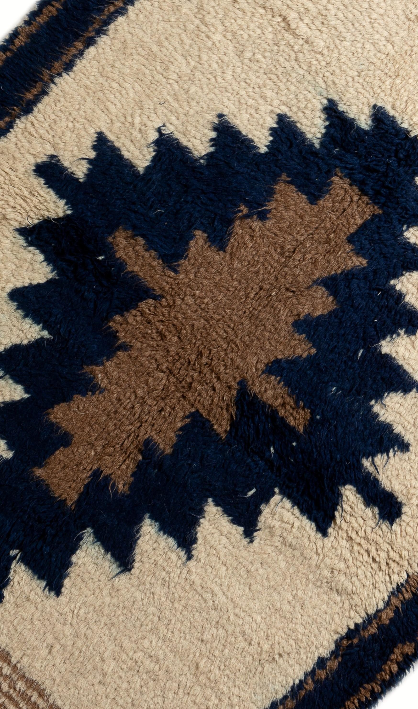 An exquisite new Turkish Tulu rug hand knotted with natural un-dyed cream and brown wool and indigo dyed blue wool. Soft, thick and comfy pile. 
A true statement piece that can easily be the focal point of any modern/contemporary interiors. 

The