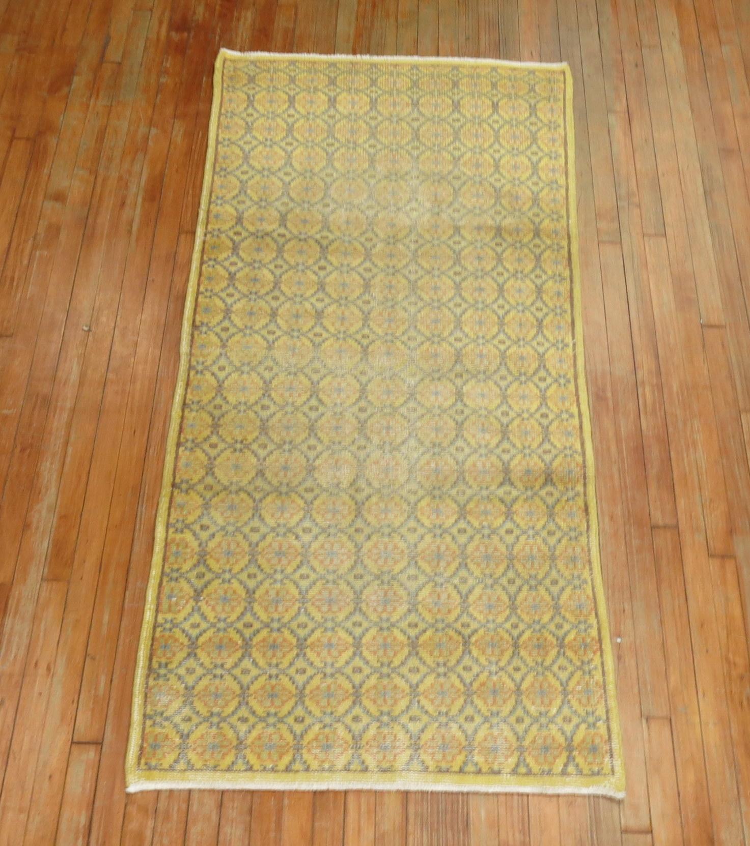 Mid-20th century scatter runner in faded soft yellow tones. Repetitive circular motif throughout.

Measures: 3' x 6'9''

   