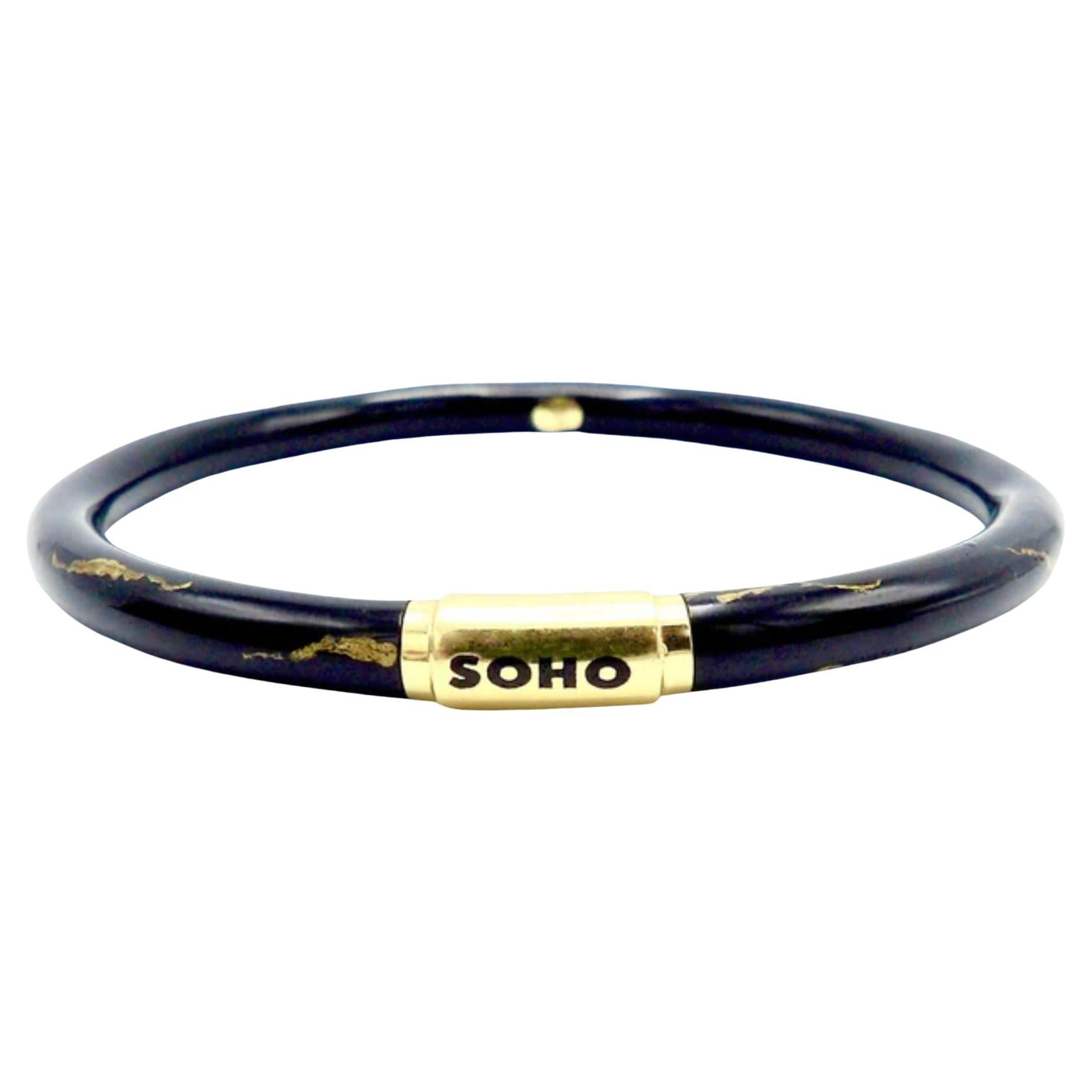 Soho 18K Gold Black Enamel Calligraphic Stripe Bangle Bracelet, circa 2010