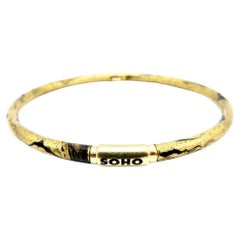 Soho 18K Gold Enamel Golden Calligraphic Stripe Bangle Bracelet, circa 2010