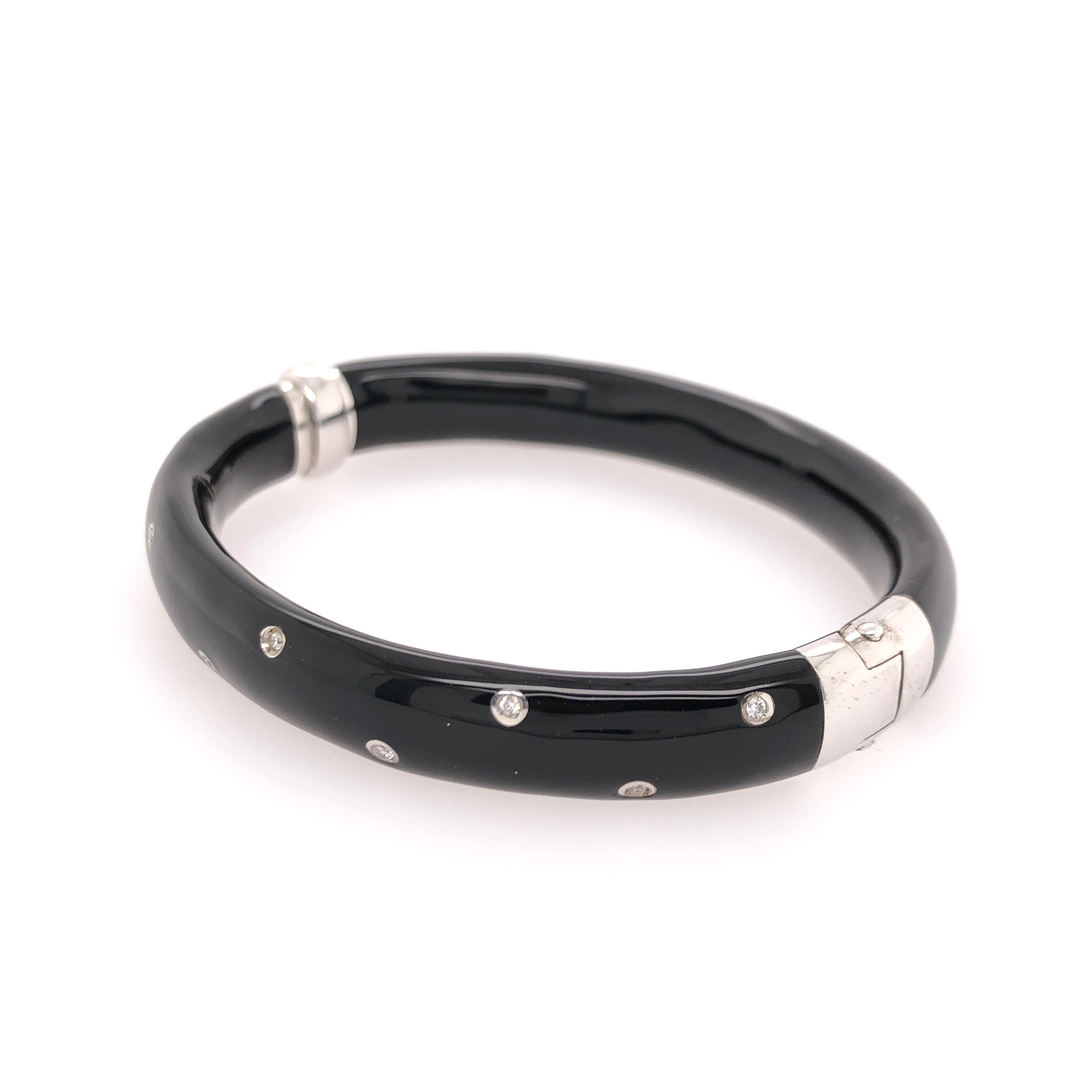 SOHO sterling silver black enamel bangle bracelet with diamonds.

Total diamond carat weight: 0.12 CT

Stamped: SOHO
