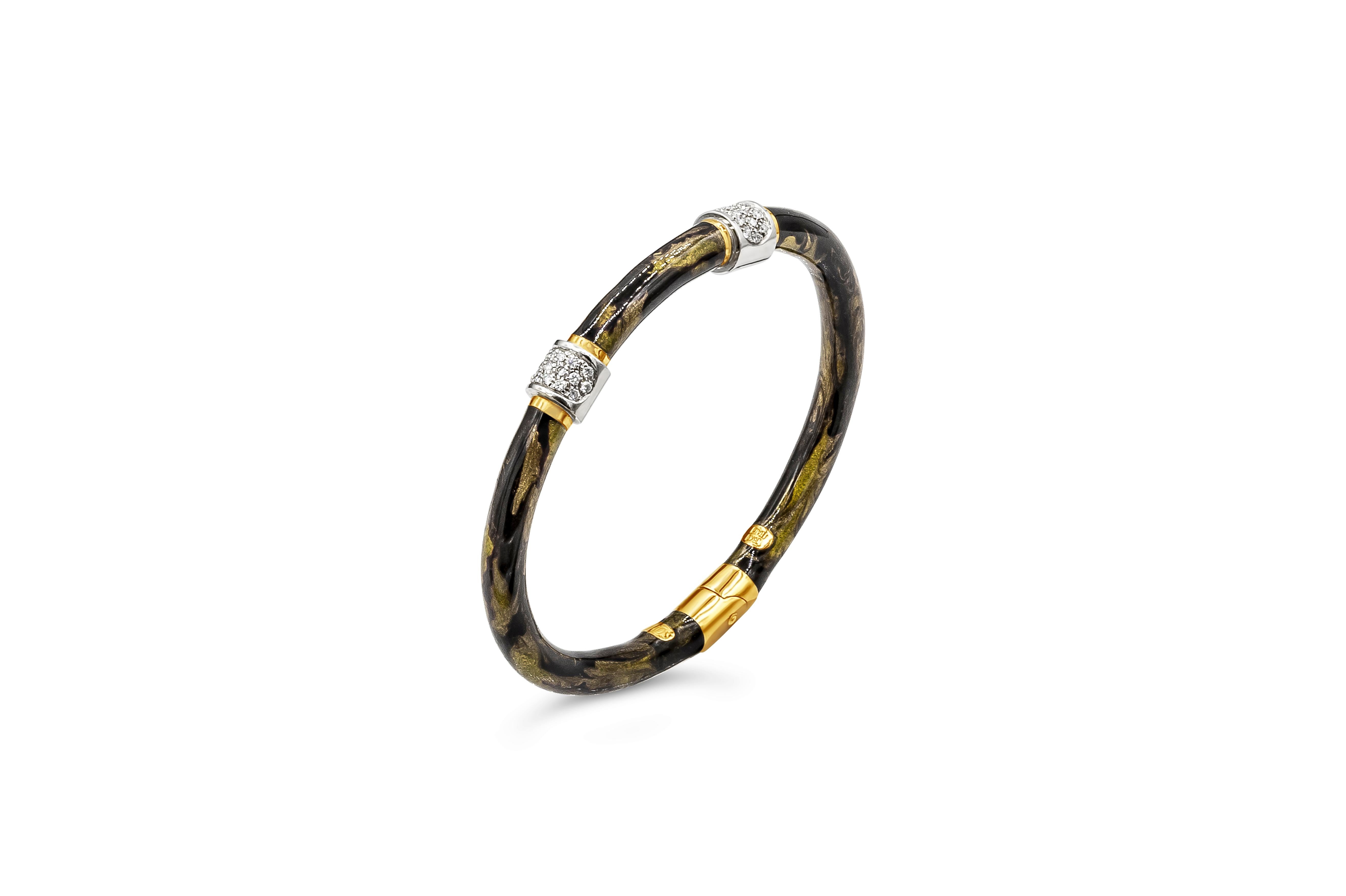 A unique bangle bracelet. This ode to tiger's eye uses a multilayered proprietary enamel finish, inlaid with Yellow Gold. Handcrafted in Italy. Diamonds weigh 0.32 carats total. 5mm hinged Bangle. 
