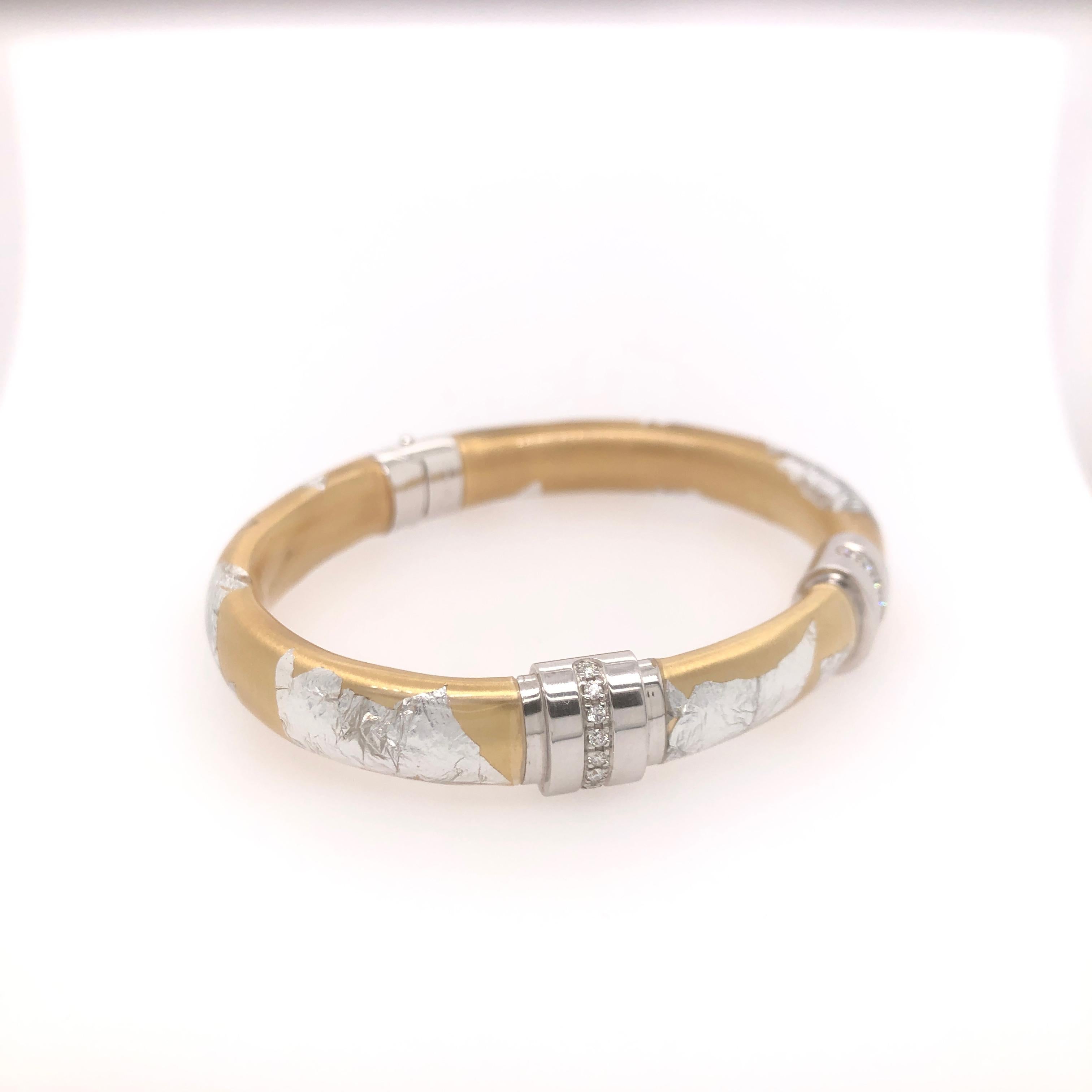 SOHO Wide Silver and Gold Foliage Bangle with Diamonds.

Total diamond carat weight: 0.48CT

Stamped: SOHO SLVR