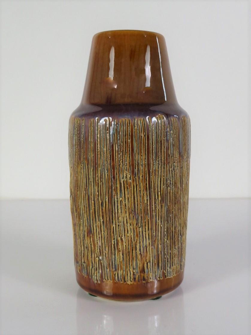 1960s beautifully glazed earthenware Soholm vase from Denmark with a sgrafitto incised body rising to a tapering necked mouth. Overall brown glaze with a bluish tinge and lighter in the incised areas. Søjolm Keramik was a ceramics manufacturer in