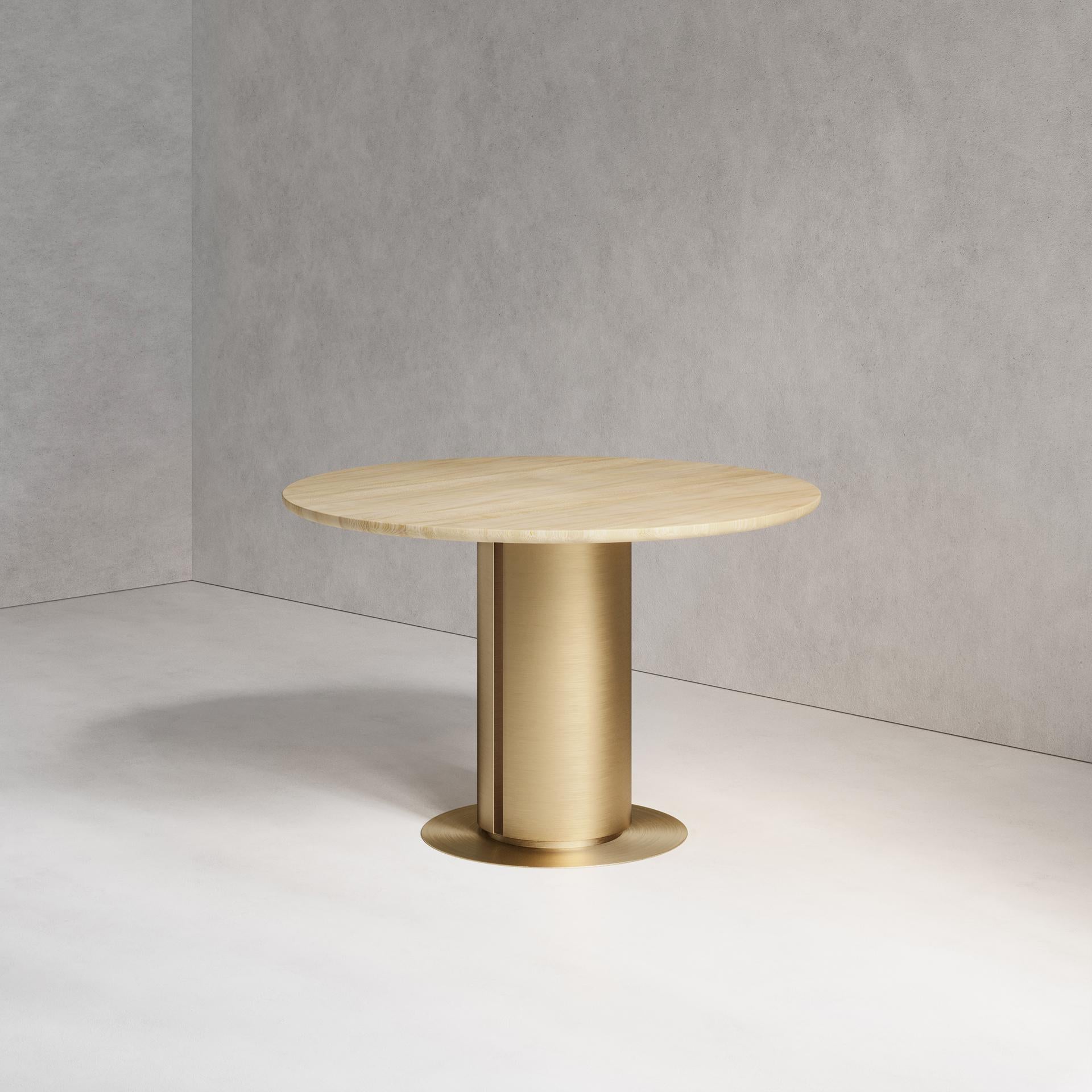 The Sol Dining Table combines both brass and wood. Using hand-spun brass, Solid Sycamore and Sycamore veneer, this piece plays with both material properties and artisan finishes. Handmade in London.

Dimensions:
Dia. 120cm (47.24”) Height 76cm