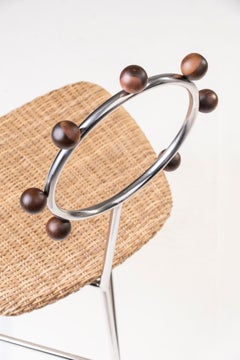 SOL minimalist chair handwoven in natural straw and stainless steel