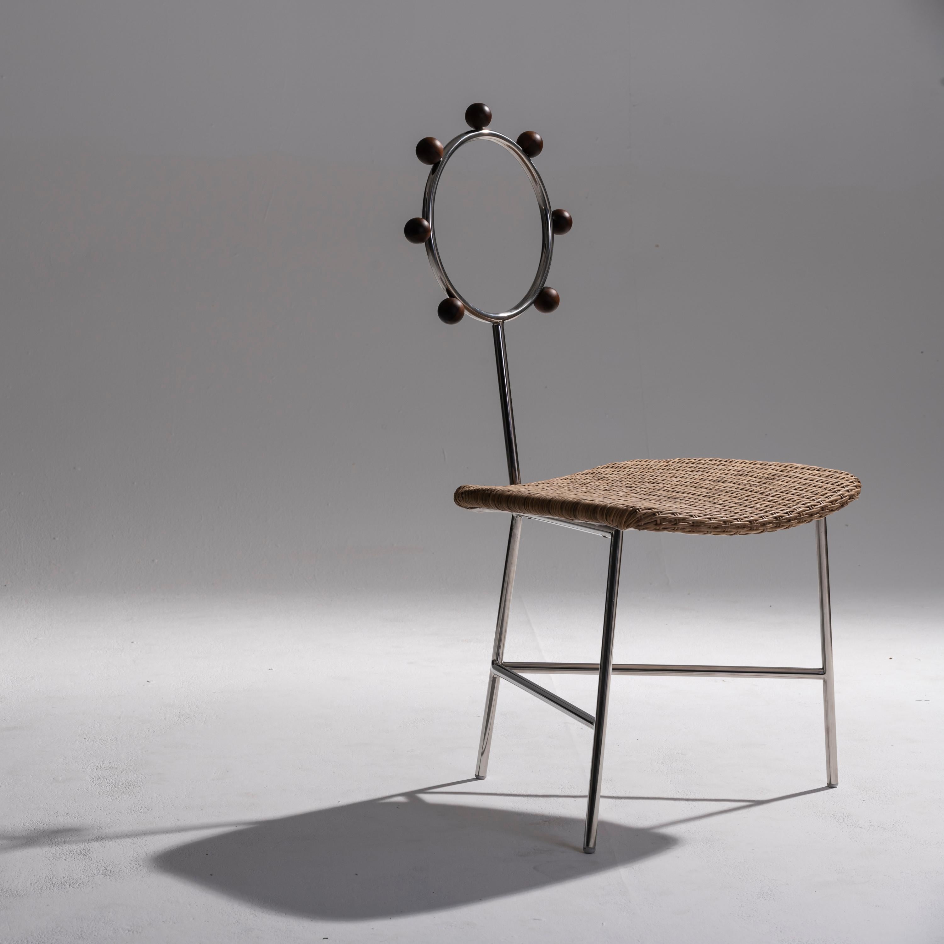 Hand-Woven SOL minimalist chair handwoven in natural straw and stainless steel For Sale