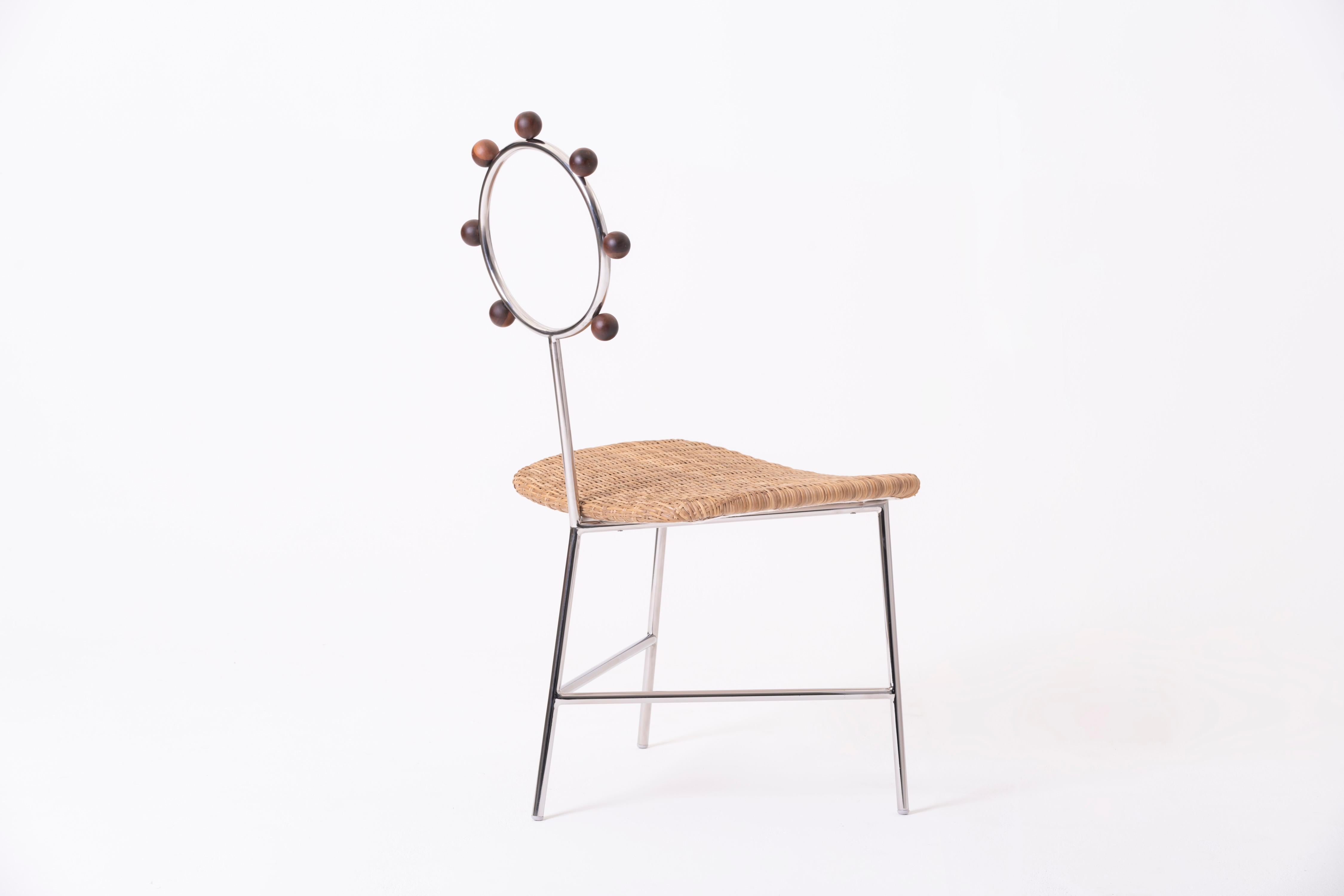 Contemporary SOL minimalist chair handwoven in natural straw and stainless steel For Sale