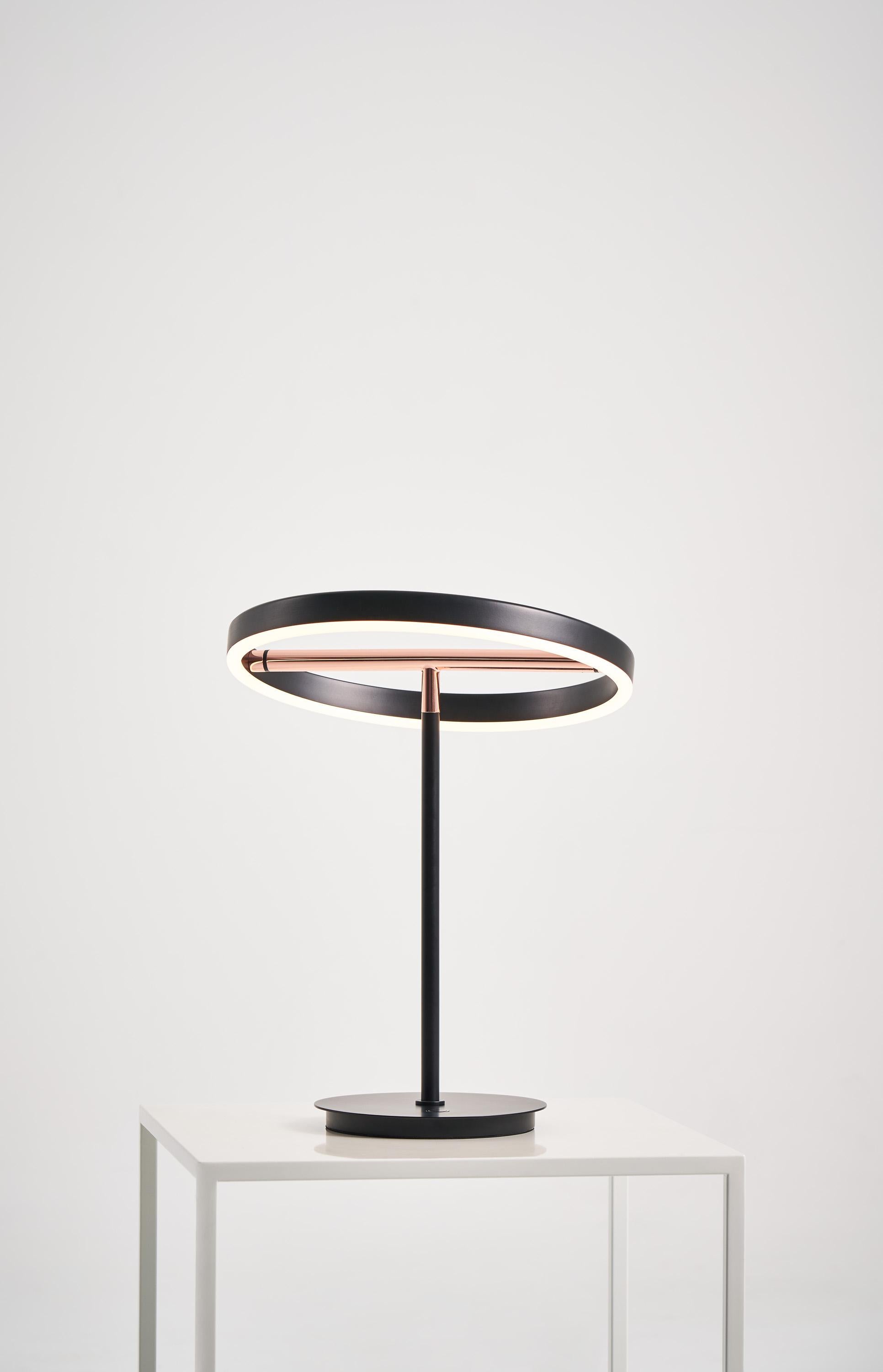 SOL collection is low-key design with elaborate consideration, consists of pendant, table lamp and even bow lamp type. SOL Table Lamp ’s ring-like lampshade is finely affixed to a metallic luster balance bar, demonstrating the definition of