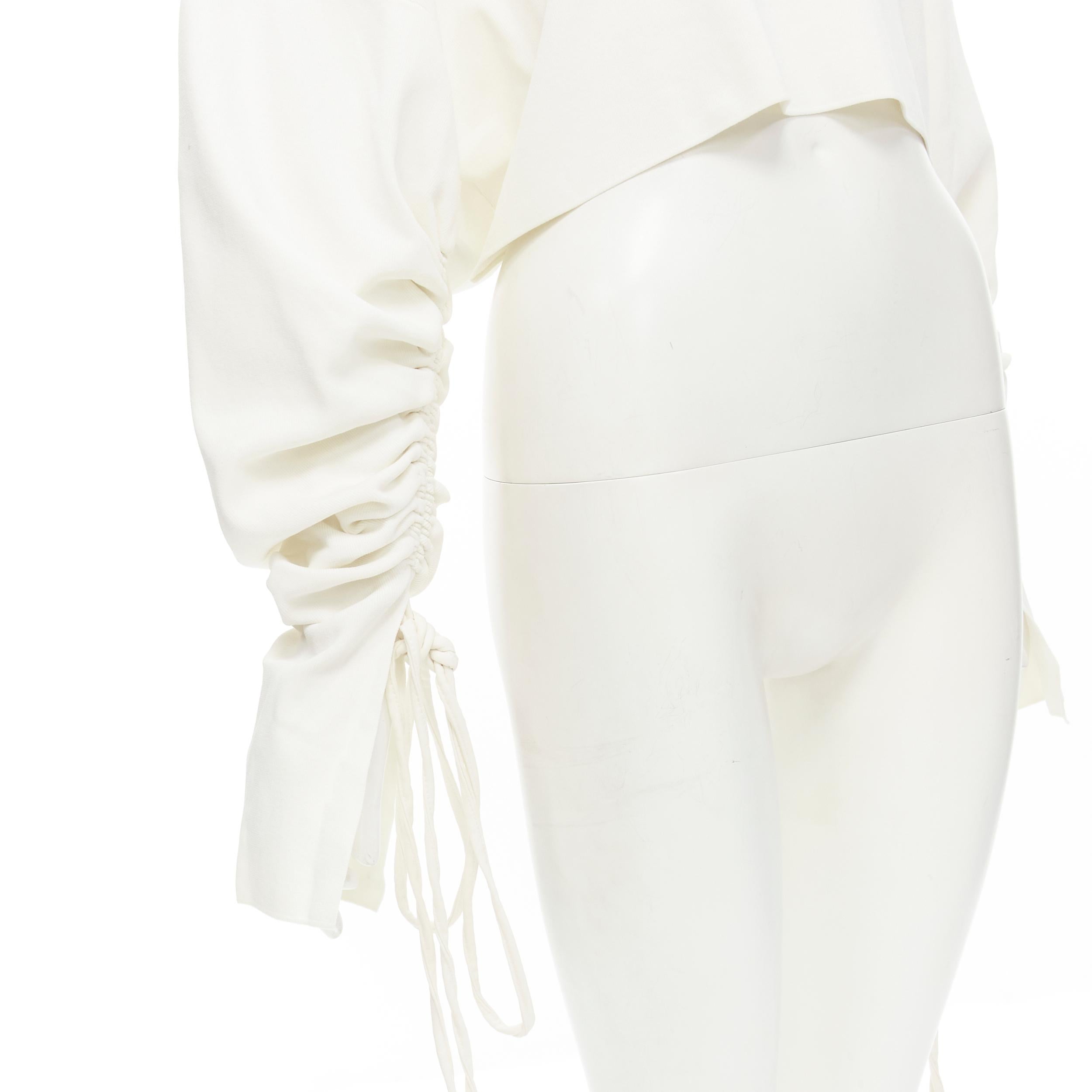 SOLACE LONDON Samara white knit cut out neckline gathered sleeve crop top US2 
Reference: KEDG/A00093 
Brand: Solace 
Material: Viscose 
Color: White 
Pattern: Solid 
Extra Detail: Turtleneck collar with triangle cut out at bust. Cropped top.