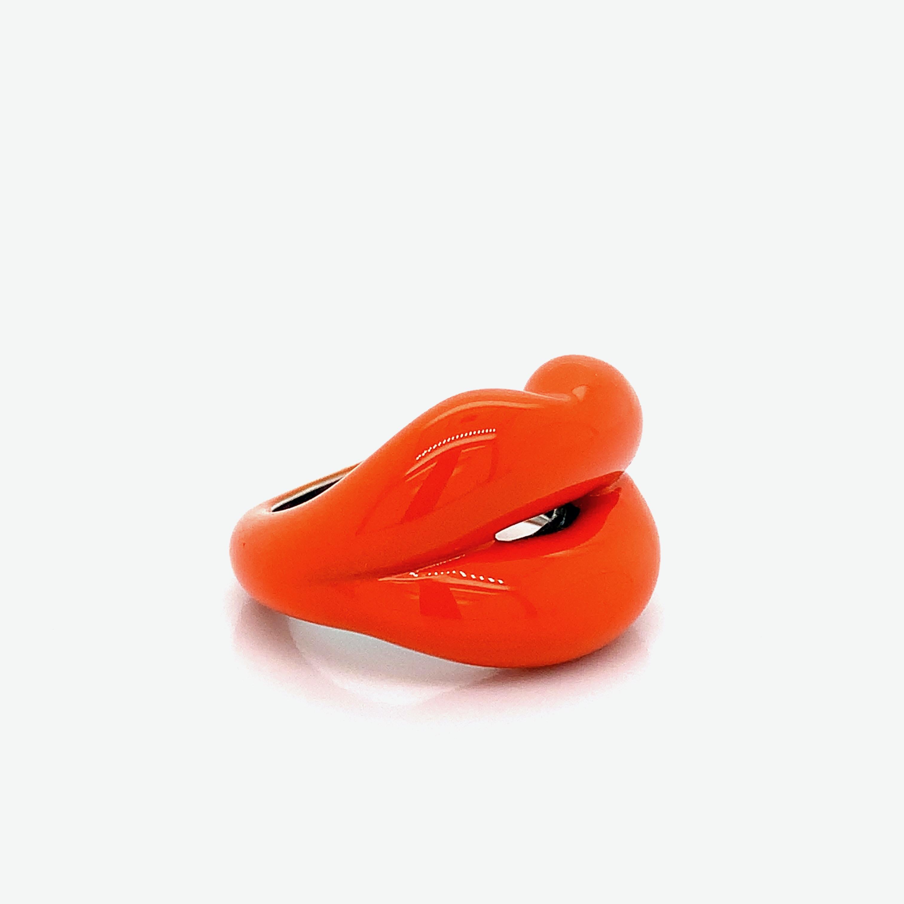 A silver ring created by Solange Azagury-Partridge with a bright orange enamel lips design. Size 5.5. Total weight: 12.0 grams. 