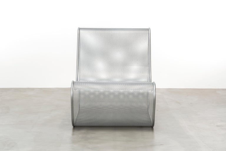 The Solange chair is a rolled perforated metal chair perfect as an accent chair indoors or outdoors. Fully custom and made to order in California.