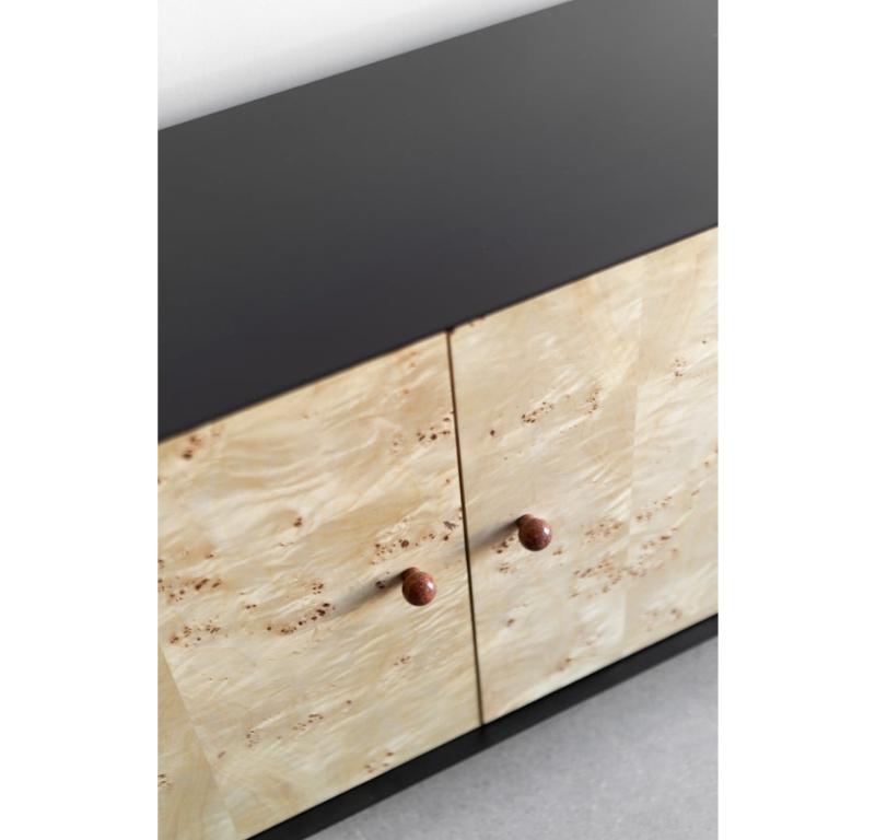 The Solano Credenza is handmade locally in Los Angeles, California. The natural rust marble pulls are a perfect complement to the mappa burl doors. The industrial steel casing is finished with a polyurethane finish. The credenza sits on unique,