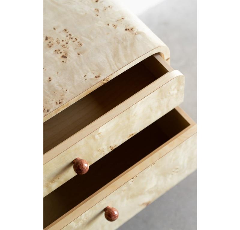 The Solano Nightstand is handmade locally in Los Angeles, California. The natural rust marble pulls are a perfect complement to the mappa burl surface. The rounded waterfall edges are capped with maroon powder coated steel feet. 

Handcrafted in Los