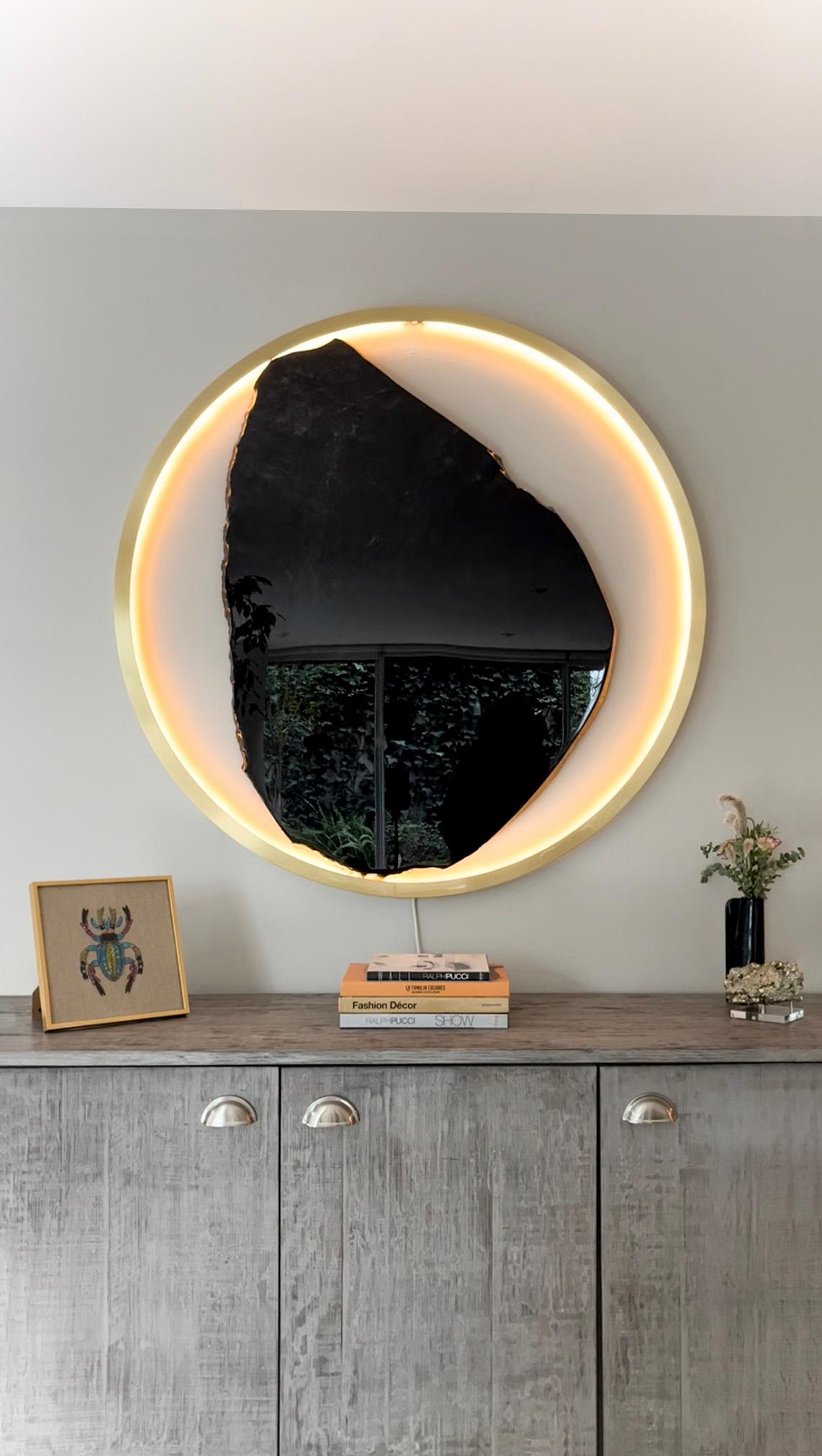 Solar Eclipse by Sten Studio


Ø 40 in or Ø 33.4 in
Obsidian, brass, LED

Brass and obsidian create a dynamic interplay of light and shadow in this piece in which the former material represents the Sun and, the latter, the Moon. While, as a