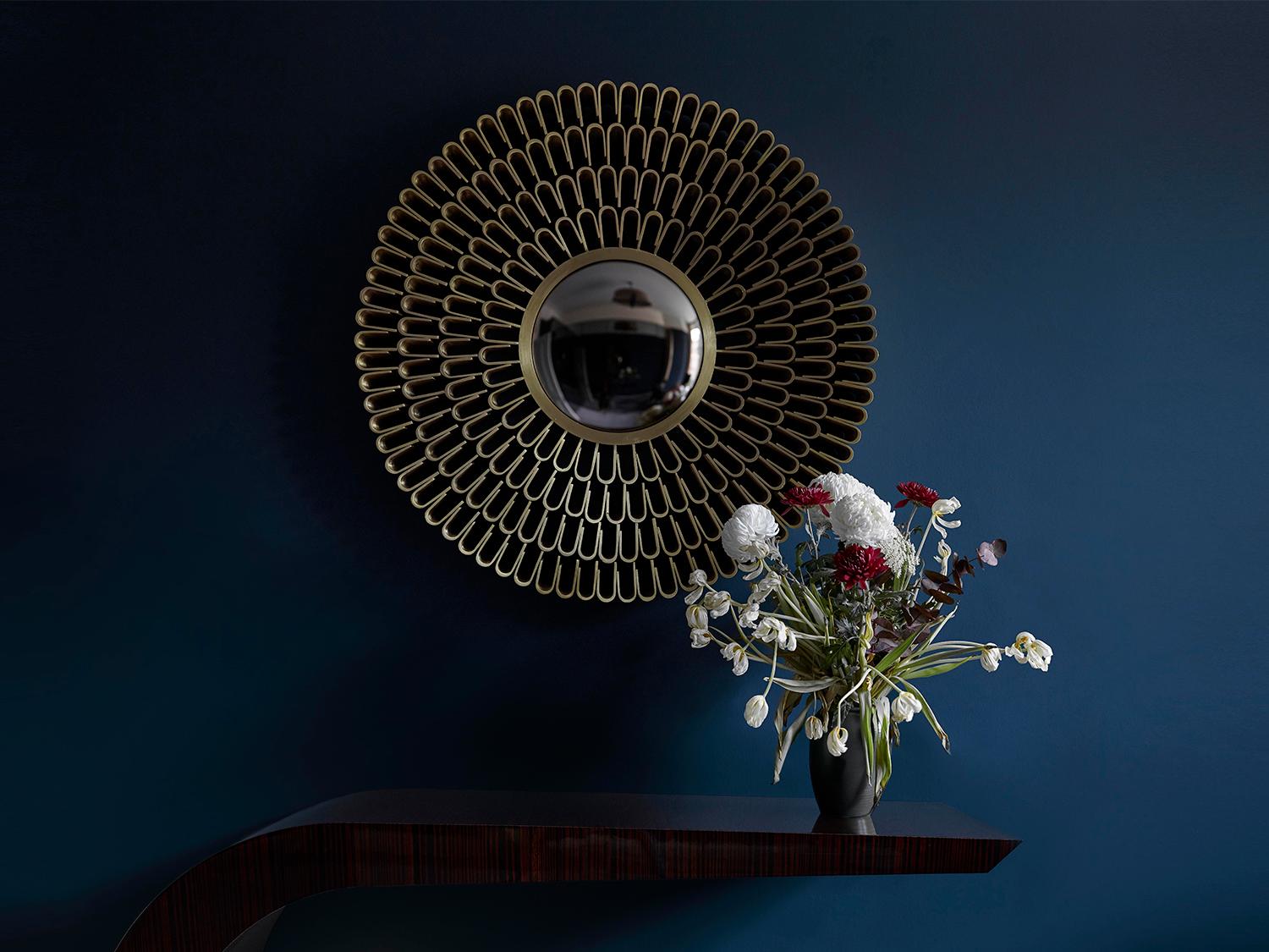 Sculptural Contemporary handcrafted sunburst wall mirror in cast brass by BelBar Studio. 

Solar Flare convex mirror is a sculptural piece with cast broken chain motifs in brass radiating from a bronze tinted mirror centrepiece. 

Influenced by the