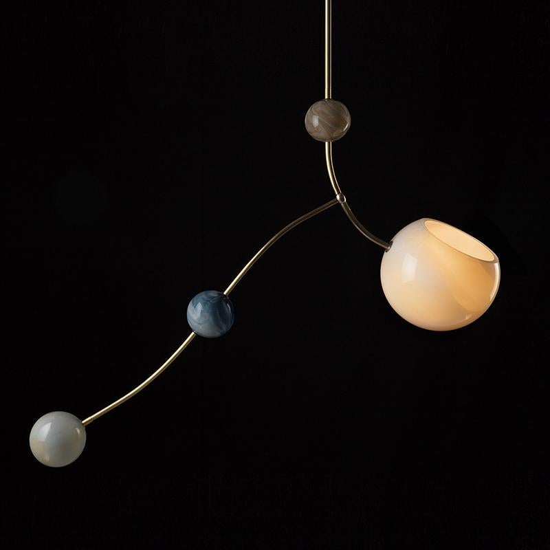 Solar pendant by Atelier George
One of a Kind
Dimensions: L 100 x l 25 x H 60 cm 
Stem length : 30 cm
Materials: Handblown glass, brass fixture
230/240 Volts 50-60 Hz 9 Watt

All our lamps can be wired according to each country. If sold to