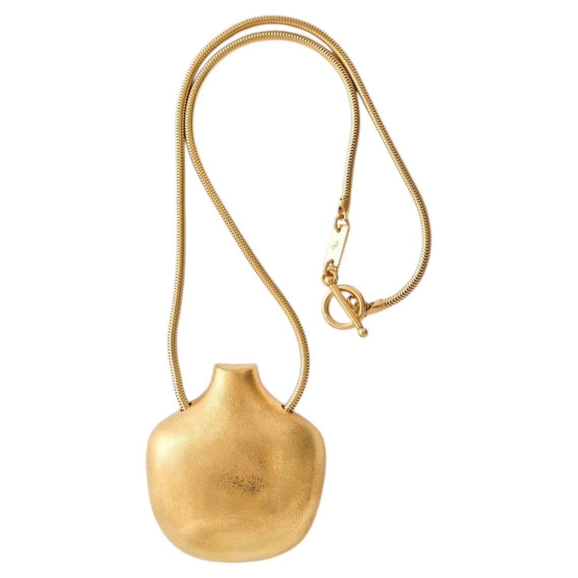 Collar con colgante en forma de sol en vermeil dorado de Aur Studio