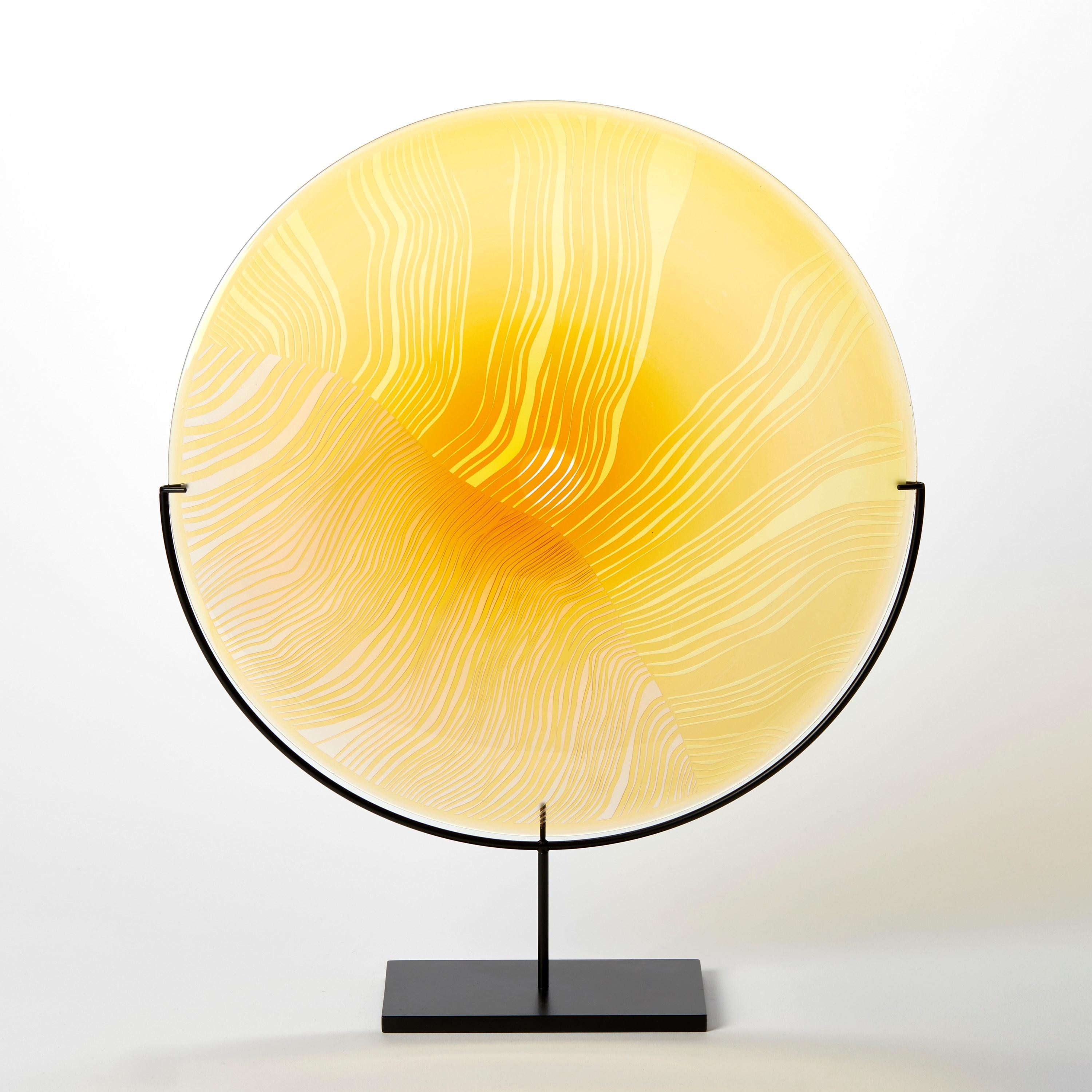 'Solar Storm Gold over Gold' is a unique handblown and cut glass artwork by the British artist, Kate Jones of Gillies Jones.

In the artist's own words:

“This new body of work references both the evident structure of the landscape and the vast