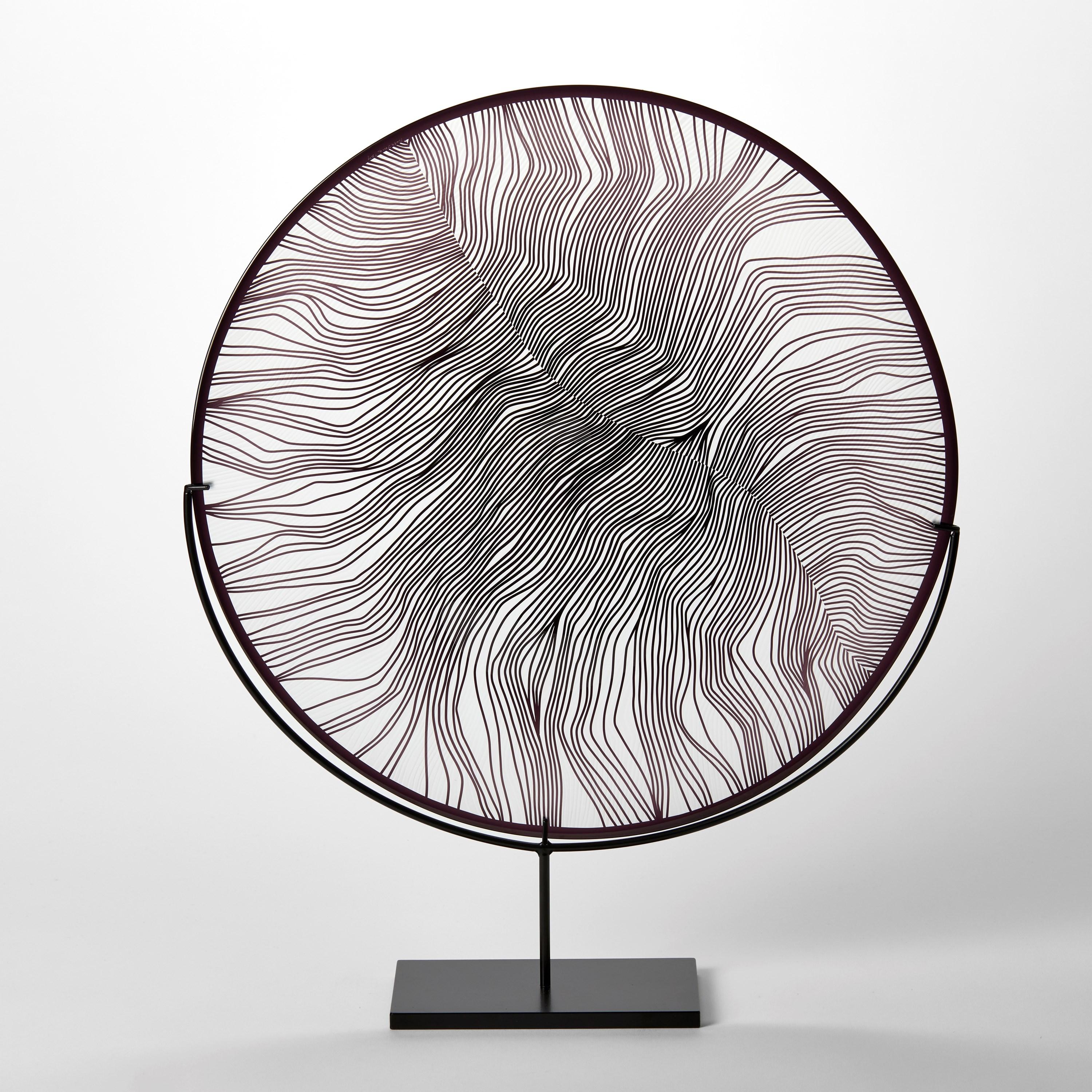 'Solar Storm Monochrome IV' is a unique handblown and cut glass artwork by the British artist, Kate Jones of Gillies Jones.

Created with Stephen Gillies, with whom Jones makes many works in collaboration, these exquisite sculptural plates are