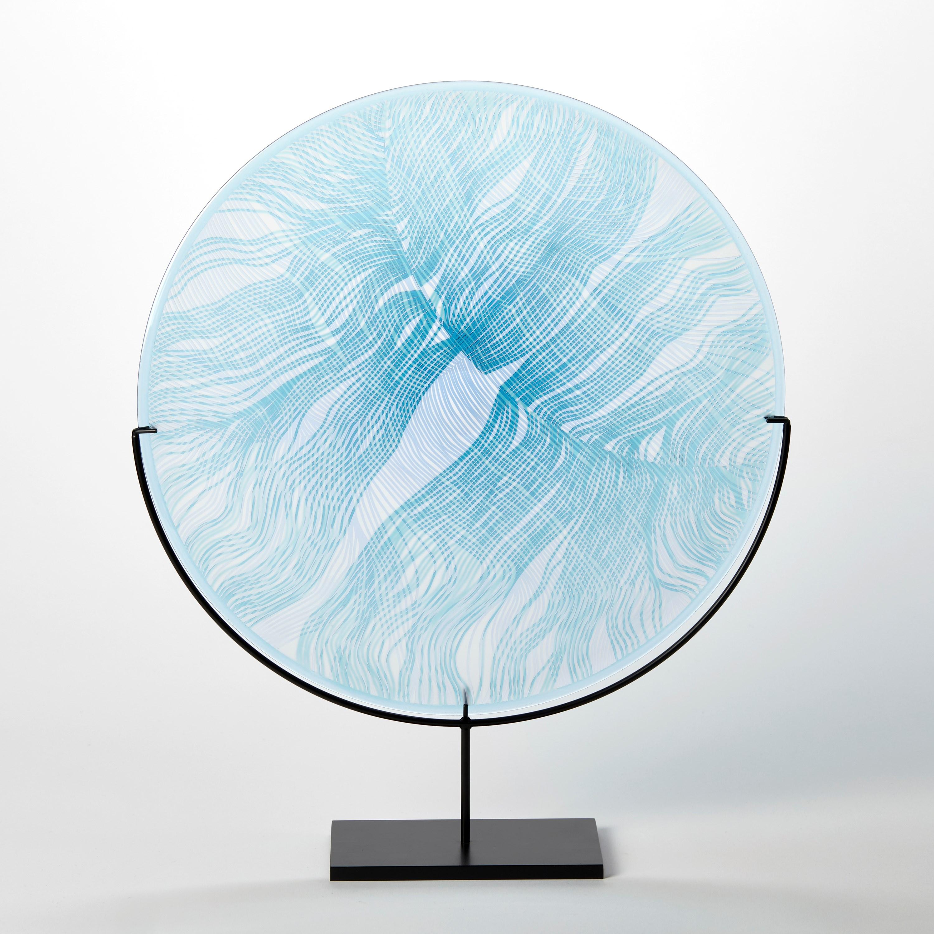 'Solar Storm Sky Blue over Ice Blue II' is a unique handblown and cut glass artwork by the British artist, Kate Jones of Gillies Jones.

In the artist's own words:

“This new body of work references both the evident structure of the landscape and