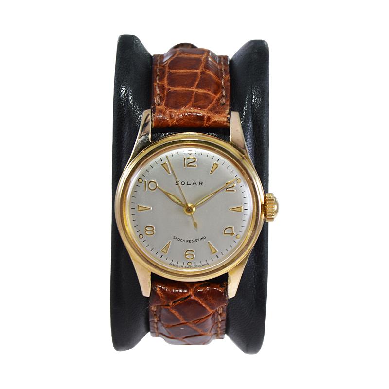 FACTORY / HOUSE: Solar Watch Company
STYLE / REFERENCE: Round 
METAL / MATERIAL: Yellow Gold Filled
CIRCA / YEAR: 1950's
DIMENSIONS / SIZE: 36mm x 28mm
MOVEMENT / CALIBER: Manual Winding / 17 Jewels 
DIAL / HANDS: Silvered with Arabic Numerals /