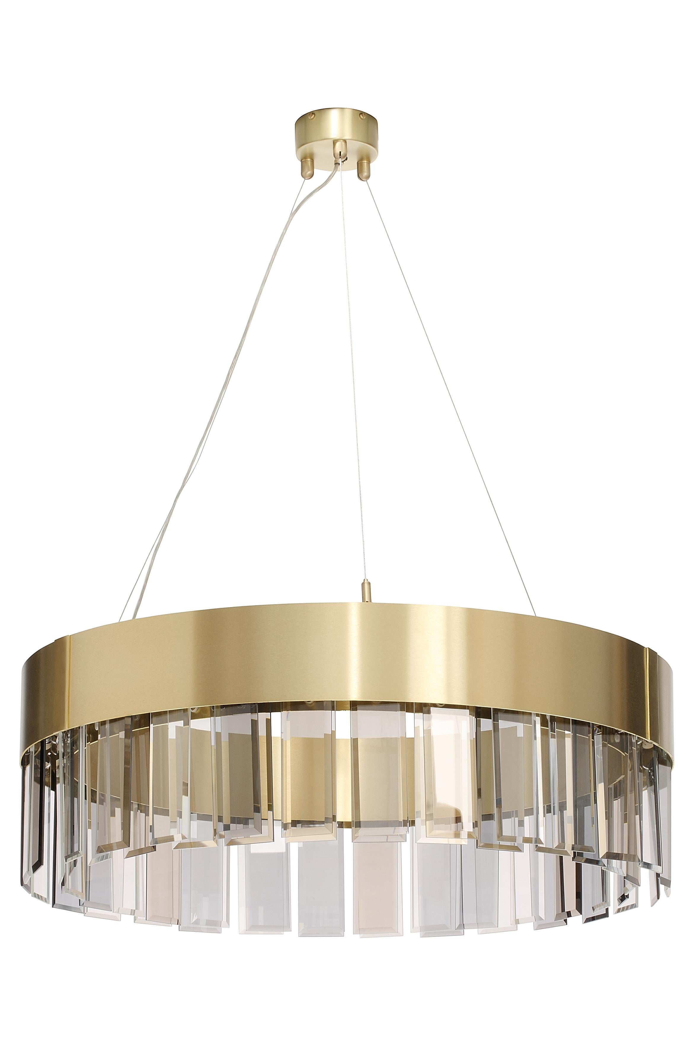 Solaris 700 pendant by CTO Lighting
Materials: satin brass with cut glass drops and stainless steel suspension wire/clear flex
Dimensions: H 25 x W 70 cm 

All our lamps can be wired according to each country. If sold to the USA it will be wired