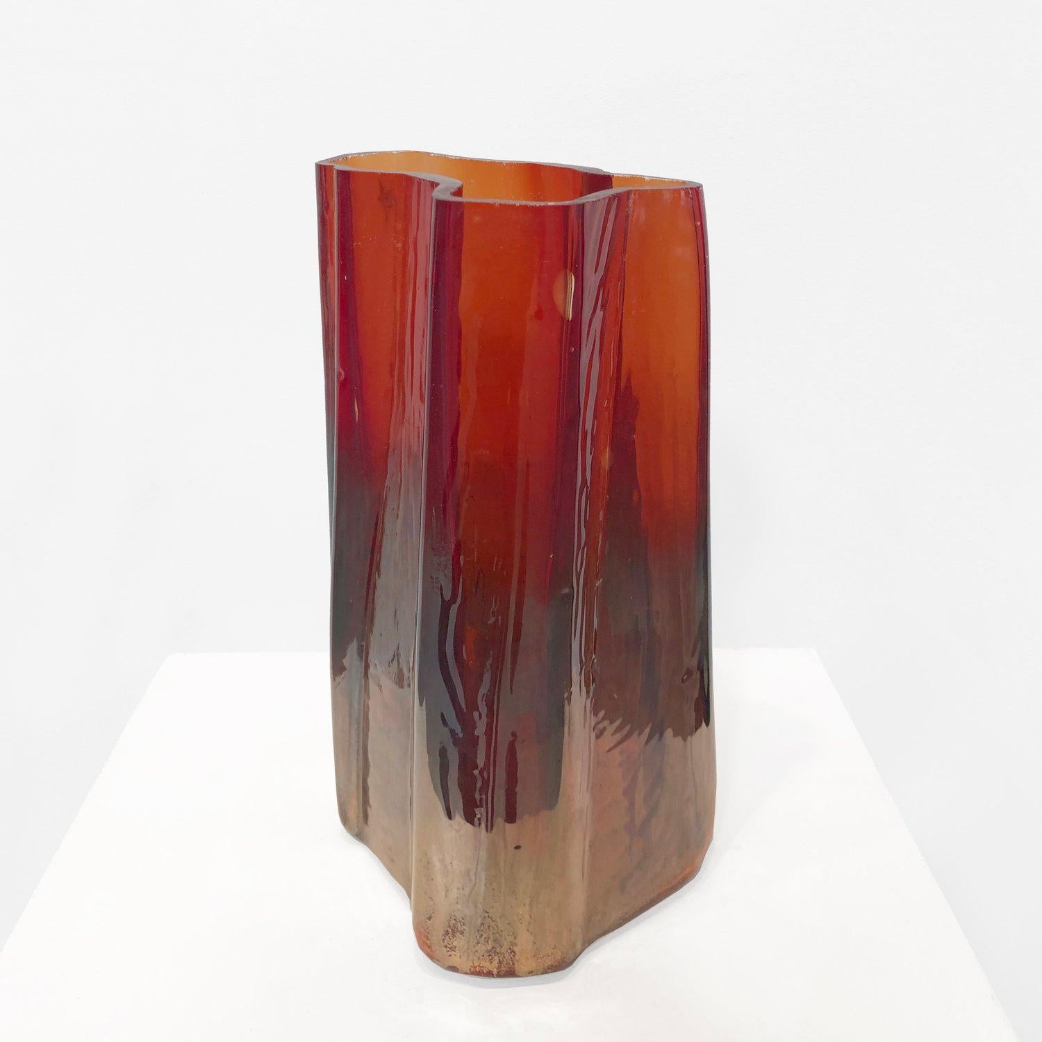 Solarized Cleaving Ghost Vase. Hand Blown Crystal Glass and Ruby transparent color, faded silvering at base. The artist blows these into Metal Sculptures that are fabricated in the studio. Based on Gregory Nangle's Classic Cleaving Series of